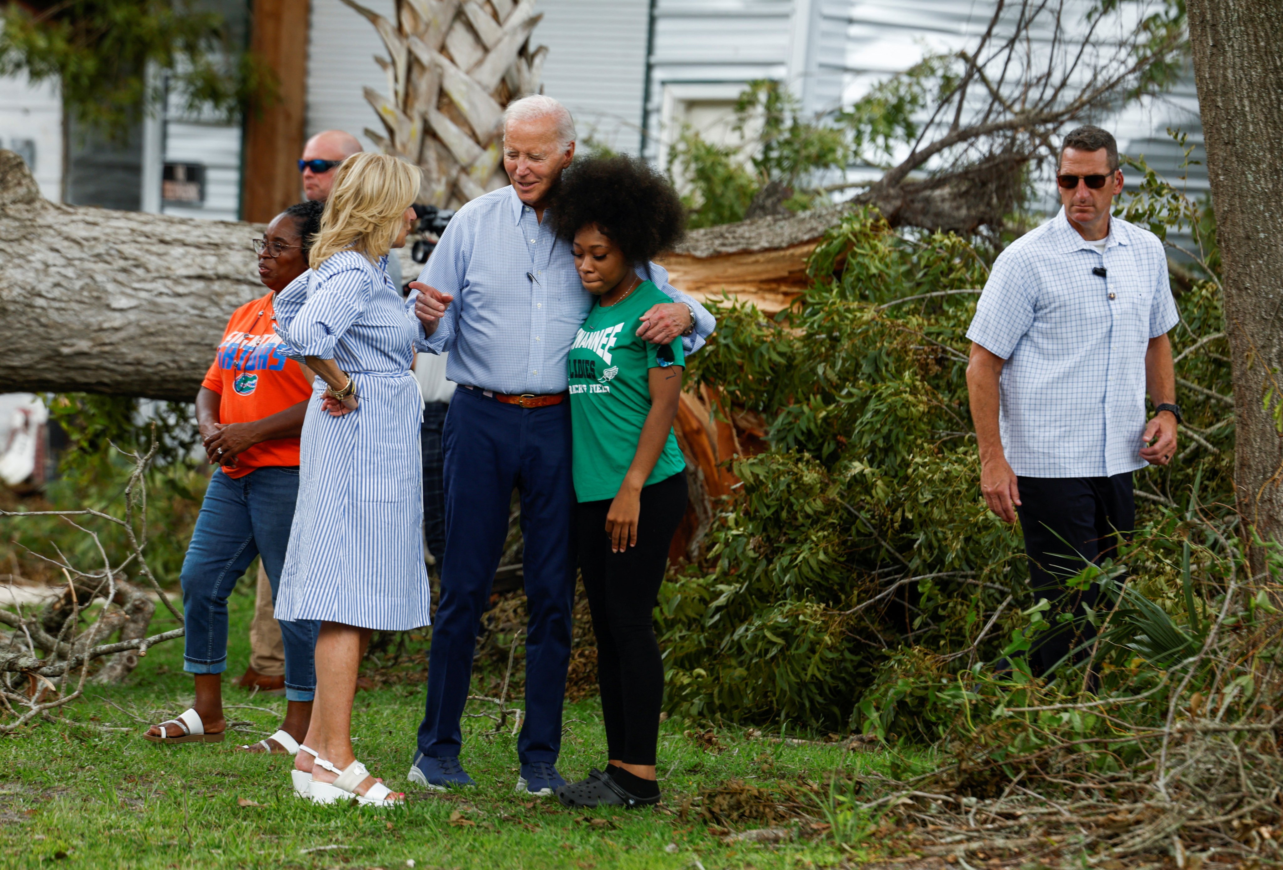 US President Joe Biden and first lady Jill Biden speak with a woman during their tour of Hurricane Idalia storm destruction in Live Oak, Florida, on Saturday. Photo: Reuters