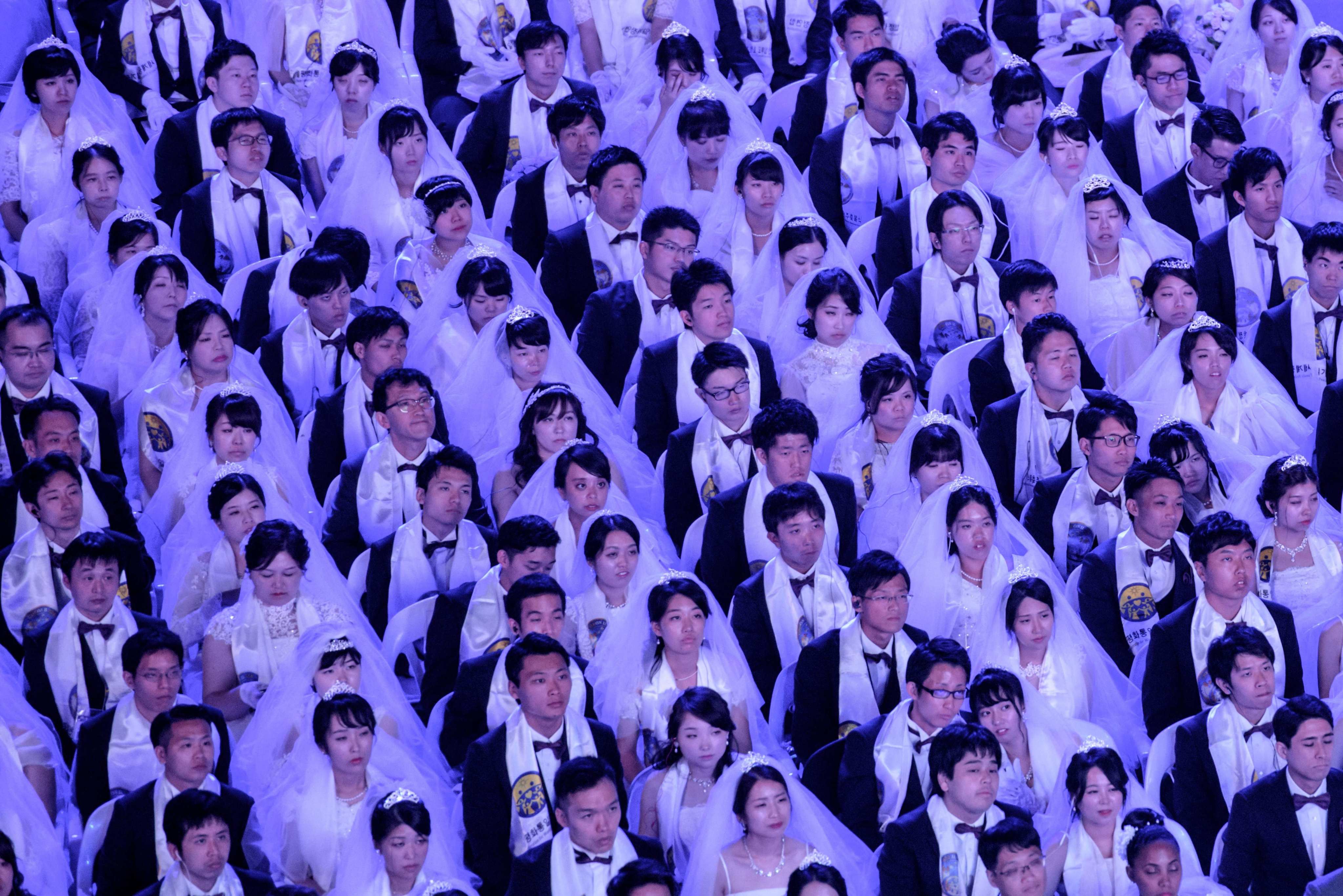 Couples from the Unification Church attend a mass wedding ceremony. Photo: AFP