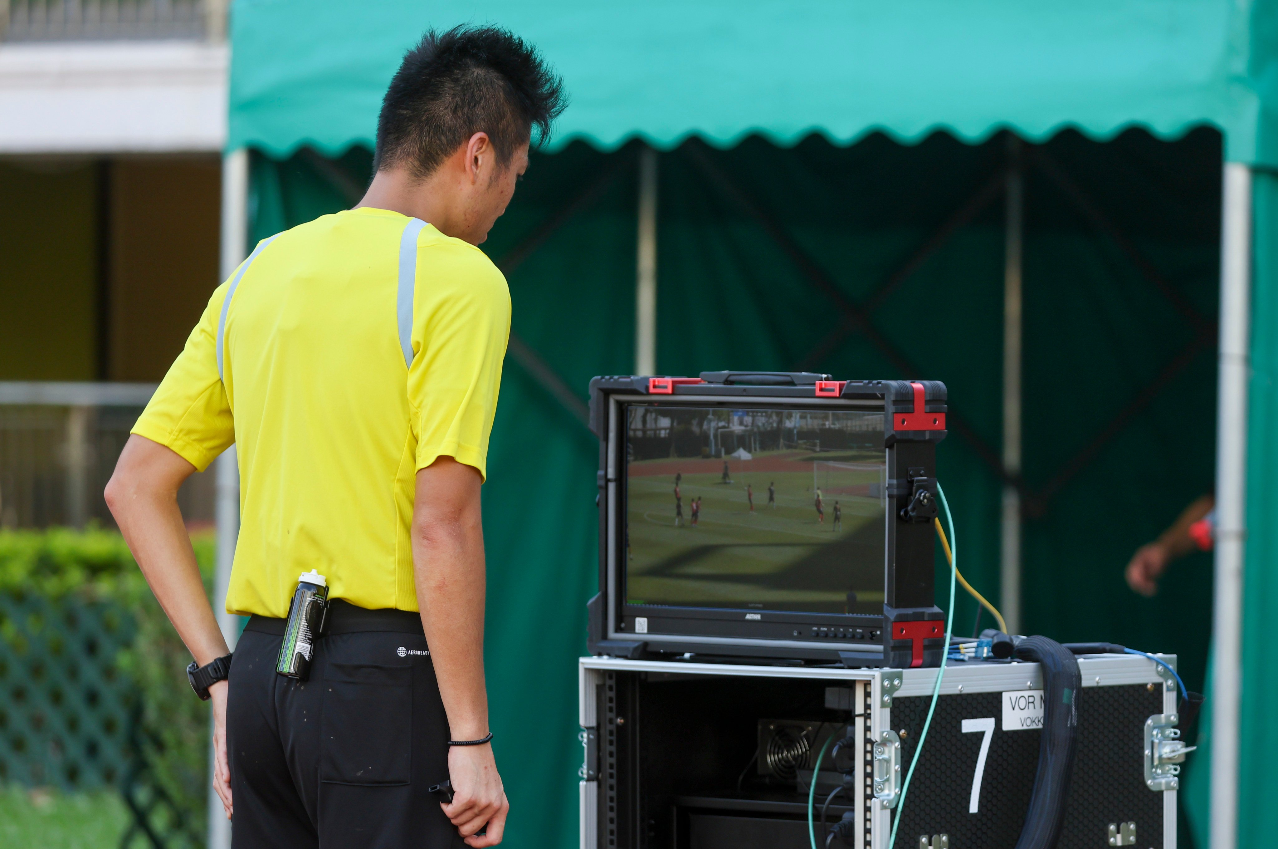 A video replay is viewed during the match between Sham Shui Po and North District. Photo: Edmond So