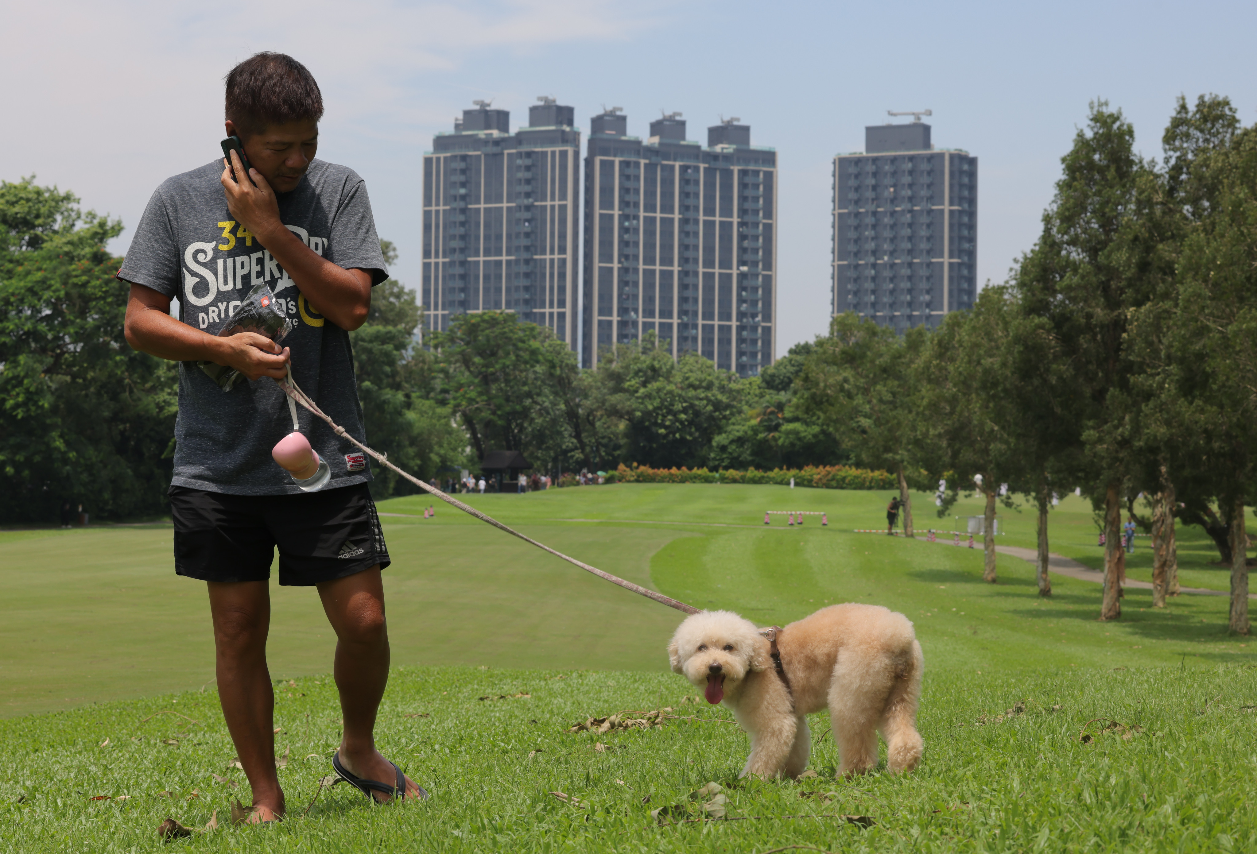 Dogwalkers were among the first visitors to a public park located on a section of a golf course taken back by authorities. Photo: Jelly Tse