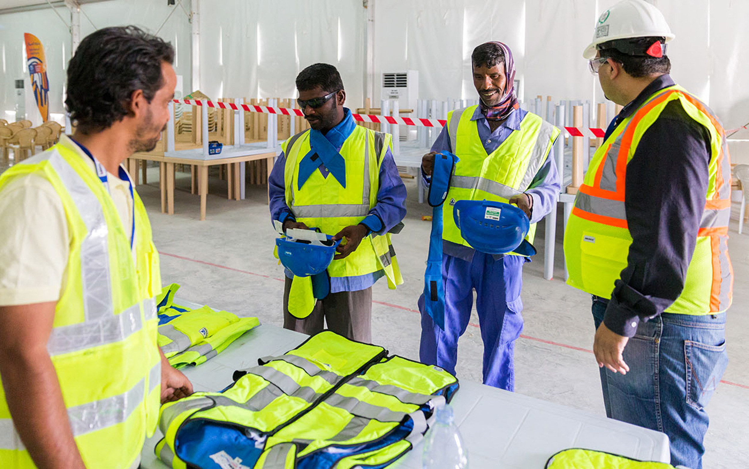 Workers in Qatar who built stadiums for last year’s World Cup try out cooling vests in 2018. As climate change causes temperatures to soar, start-ups around the world are developing clothing that beats the heat in innovative ways. Photo: AFP