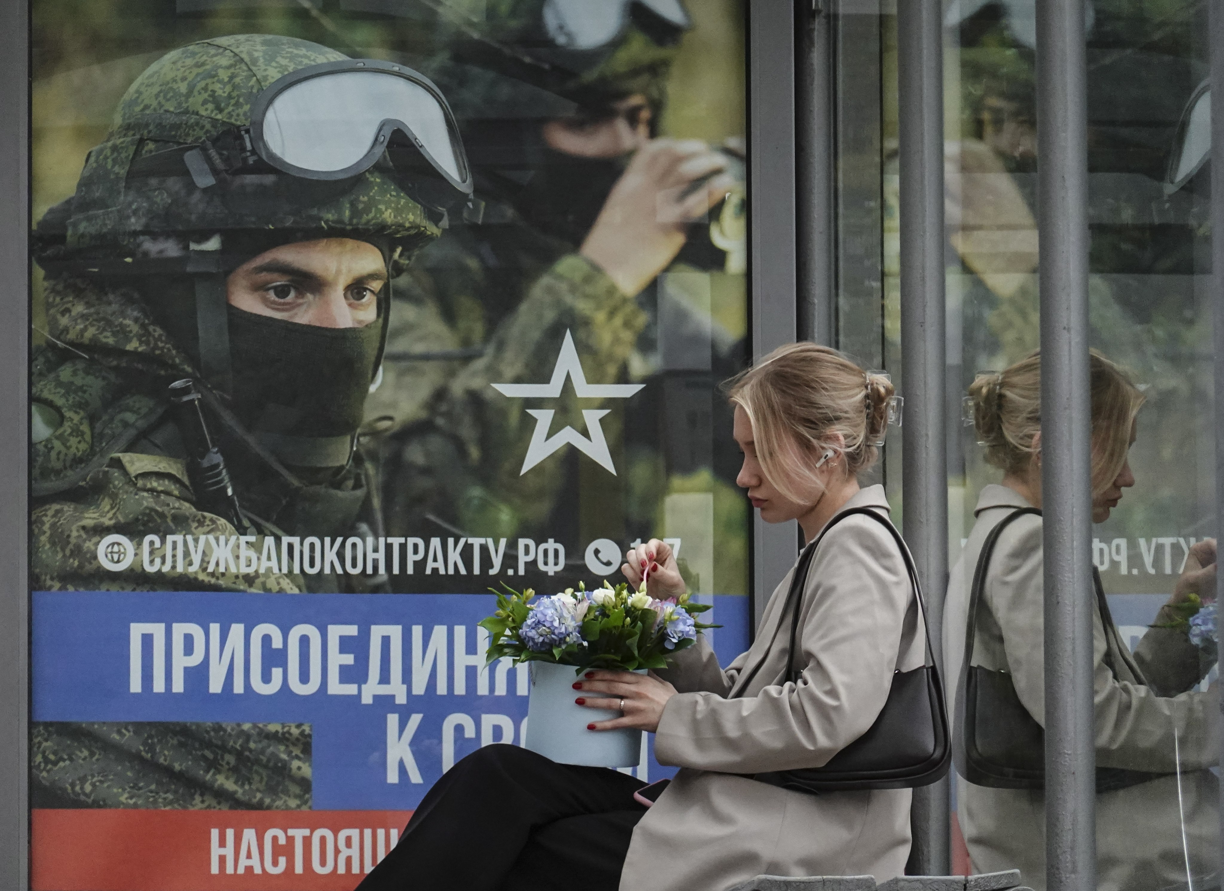 A Russian military poster at a bus stop in Moscow. Photo: EPA-EFE