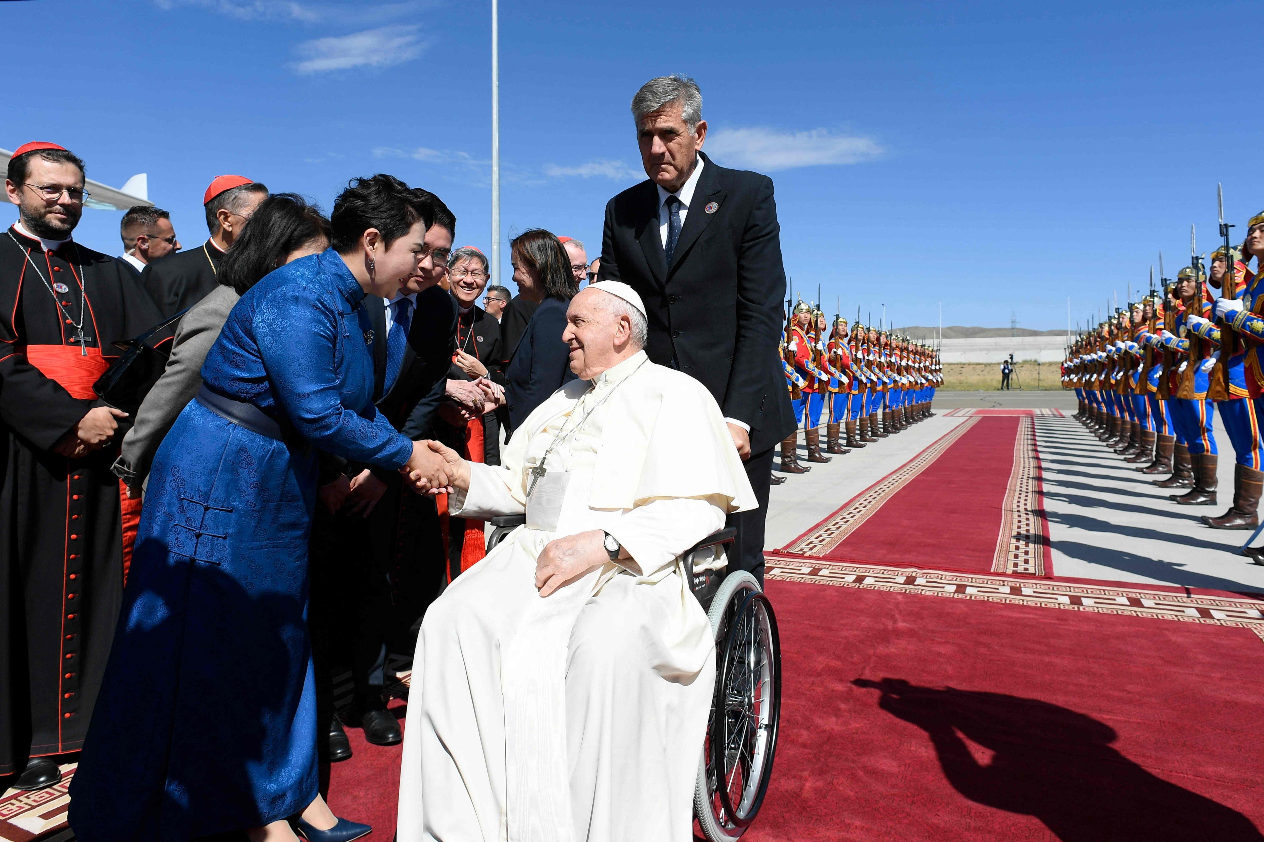 Pope Francis shakes hands with Mongolia’s minister of foreign affairs Batmunkh Battsetseg before leaving Ulaanbaatar on Monday. Photo: Vatican Media / AFP 