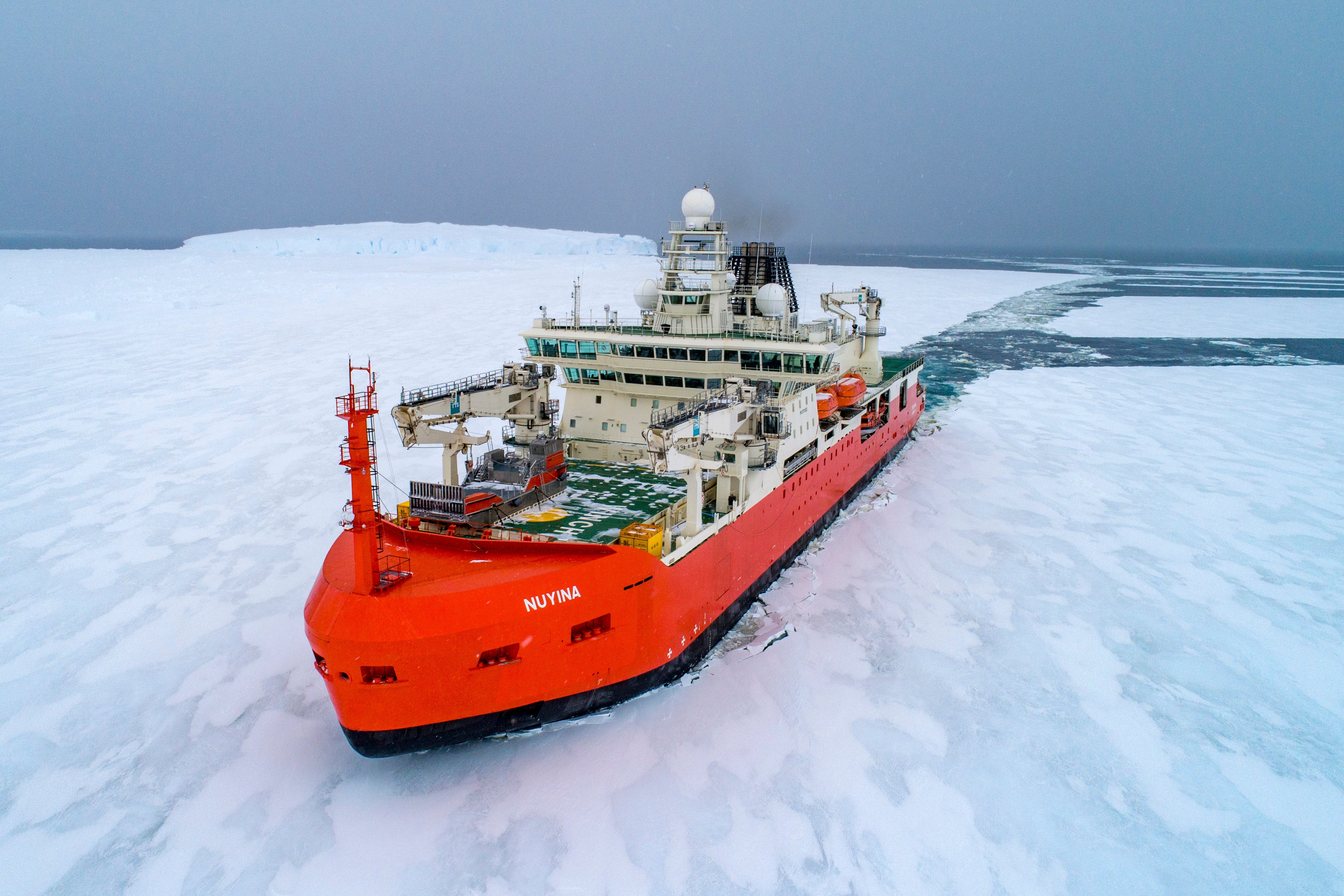 Australian icebreaker RSV Nuyina sails through the Antarctic. The ship broke through sea ice to reach a location 144km from the Casey research base before deploying helicopters to collect the patient. Photo: Australian Antarctic Division via AP