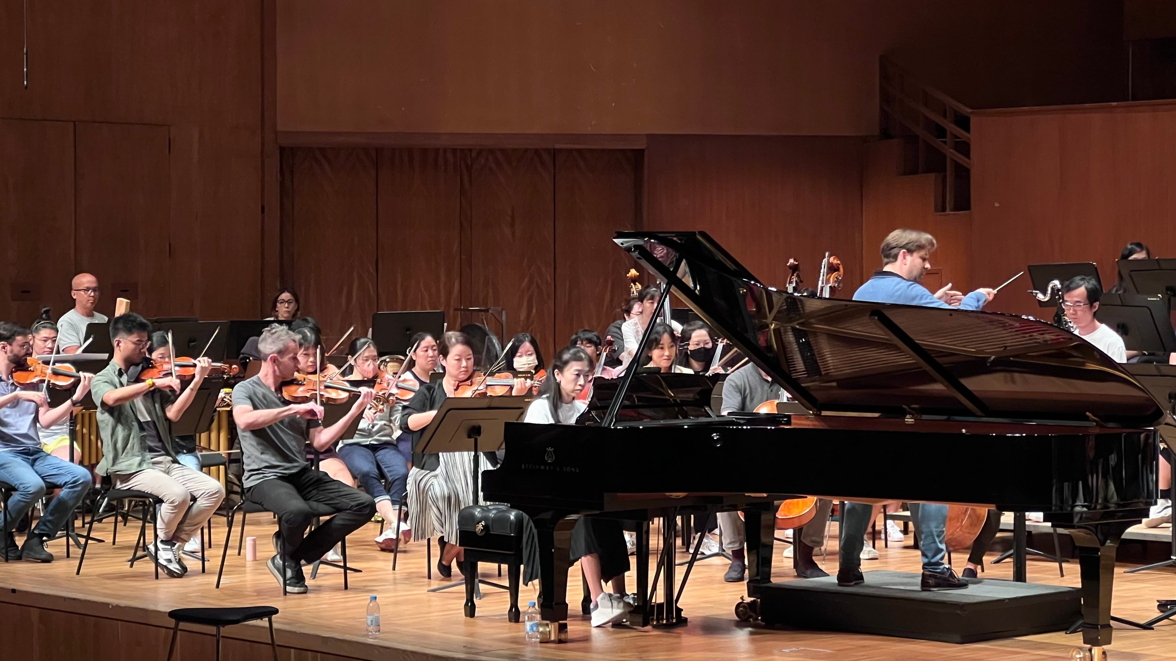 The Hong Kong Sinfonietta and soloist Colleen Lee rehearse Charles Kwong’s “Piano Concerto” on the eve of its rescheduled world premiere. The concert was cancelled soon afterwards with Typhoon Saola bearing down on the city. Photo: Hong Kong Sinfonietta