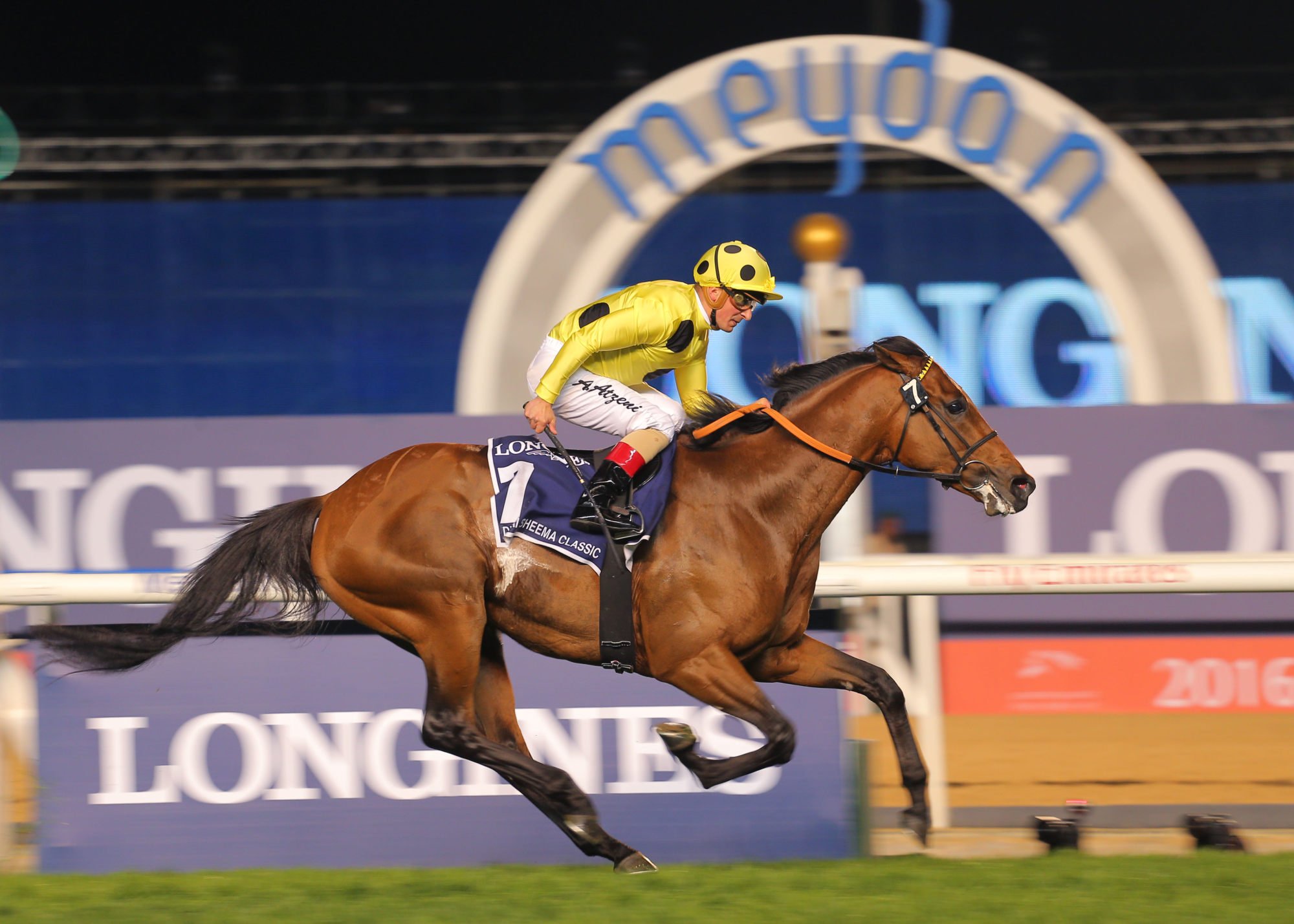 Andrea Atzeni steers Postponed to victory in the 2016 Group One Dubai Sheema Classic (2,410m) at Meydan.