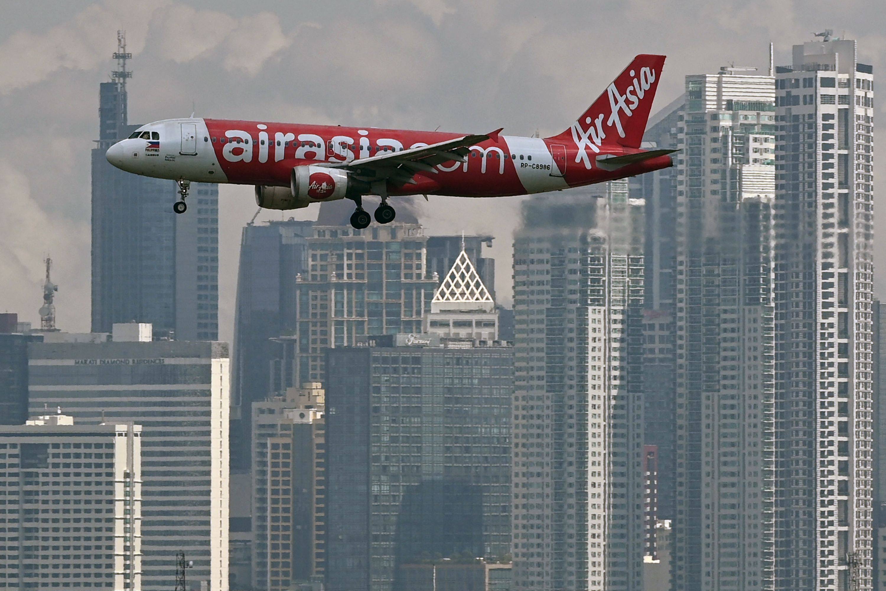 An Air Asia Airbus prepares to land at Ninoy Aquino International airport. Photo: AFP