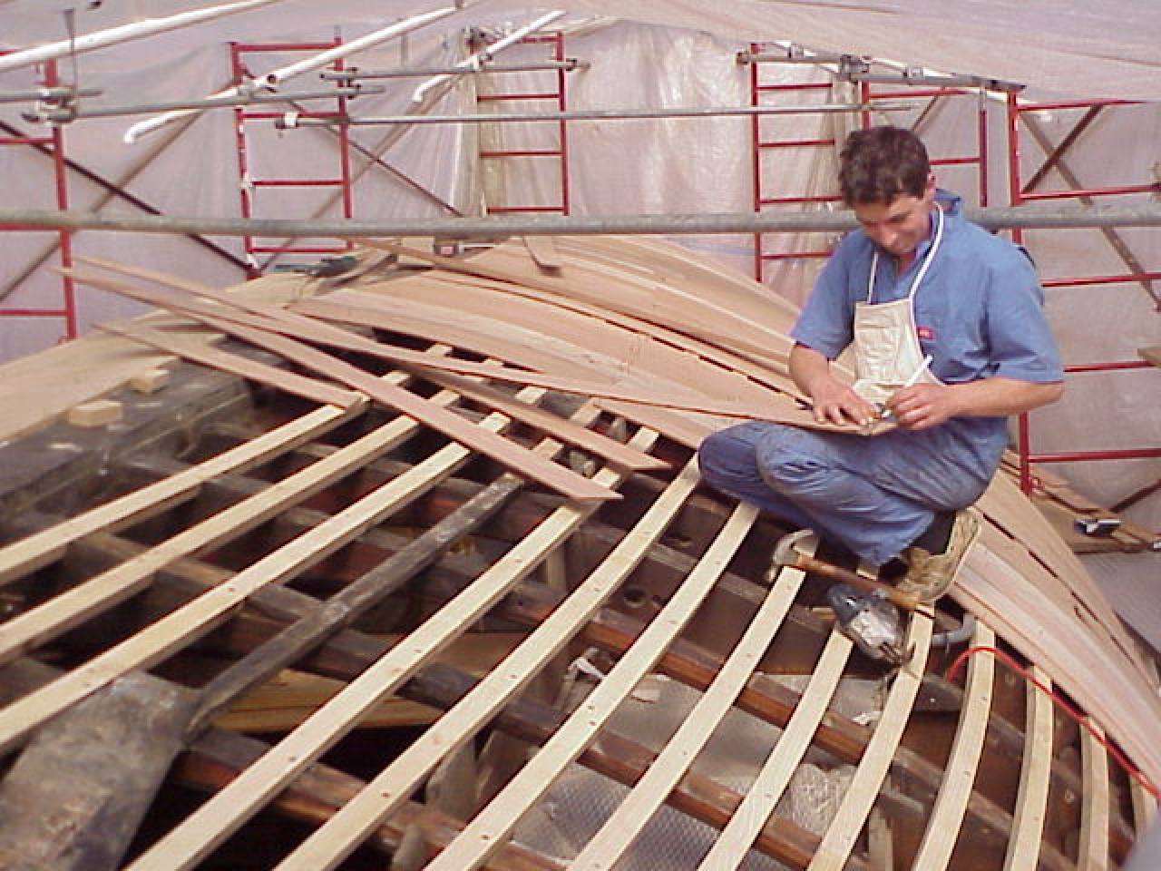Sauvadet in 2001 works on the restoration of a large racing boat from the first Whitbread Round the World Race, held in 1973. Photo: Pierre Sauvadet