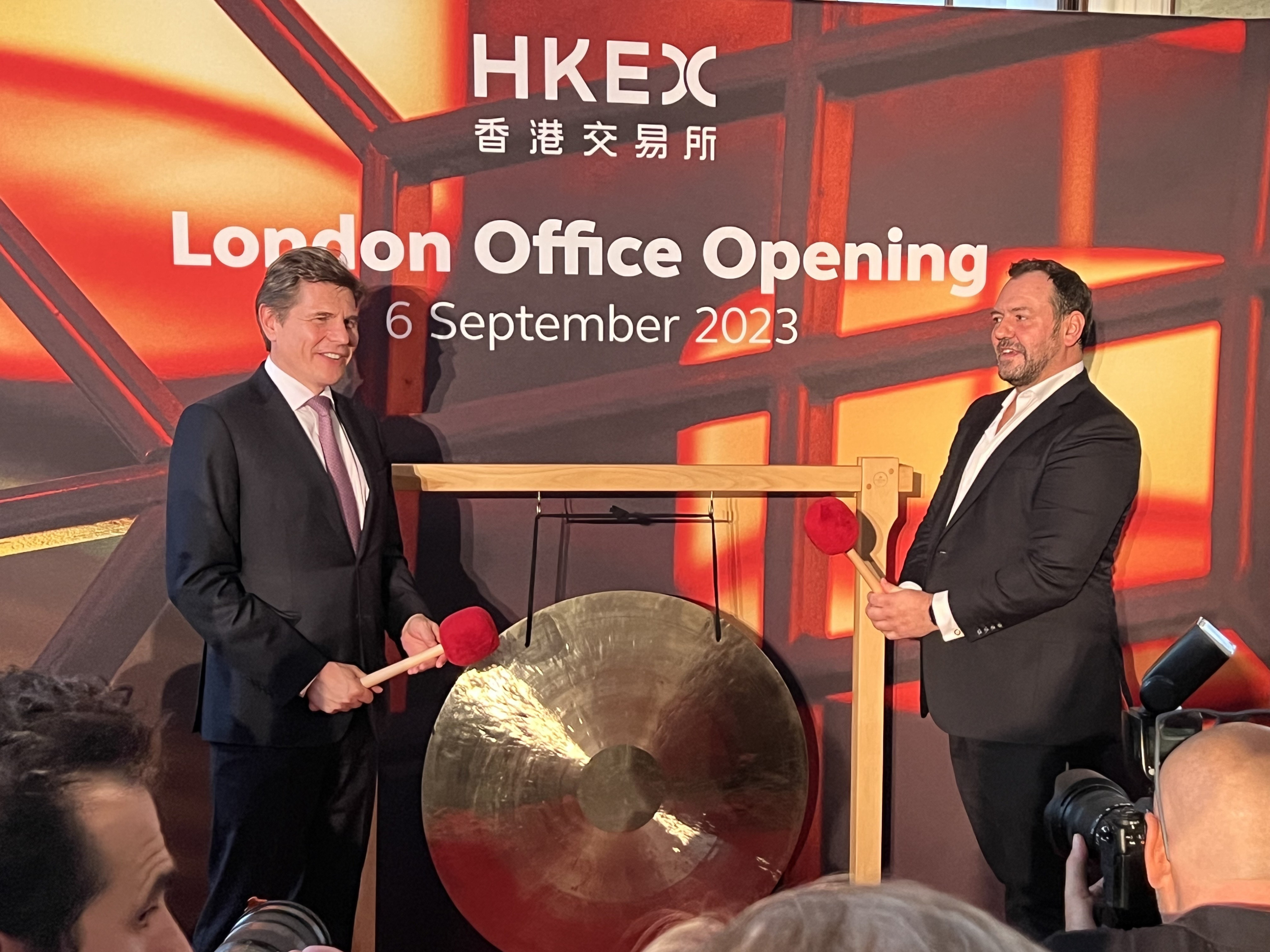 Nicolas Aguzin, Hong Exchanges and Clearing (HKEX) CEO, left, and Kevin Rideout, HKEX’s co-head of sales and marketing, ring a ceremonial gong to celebrate the opening of the bourse operator’s new office in London on September 6, 2023. Photo: Chad Bray