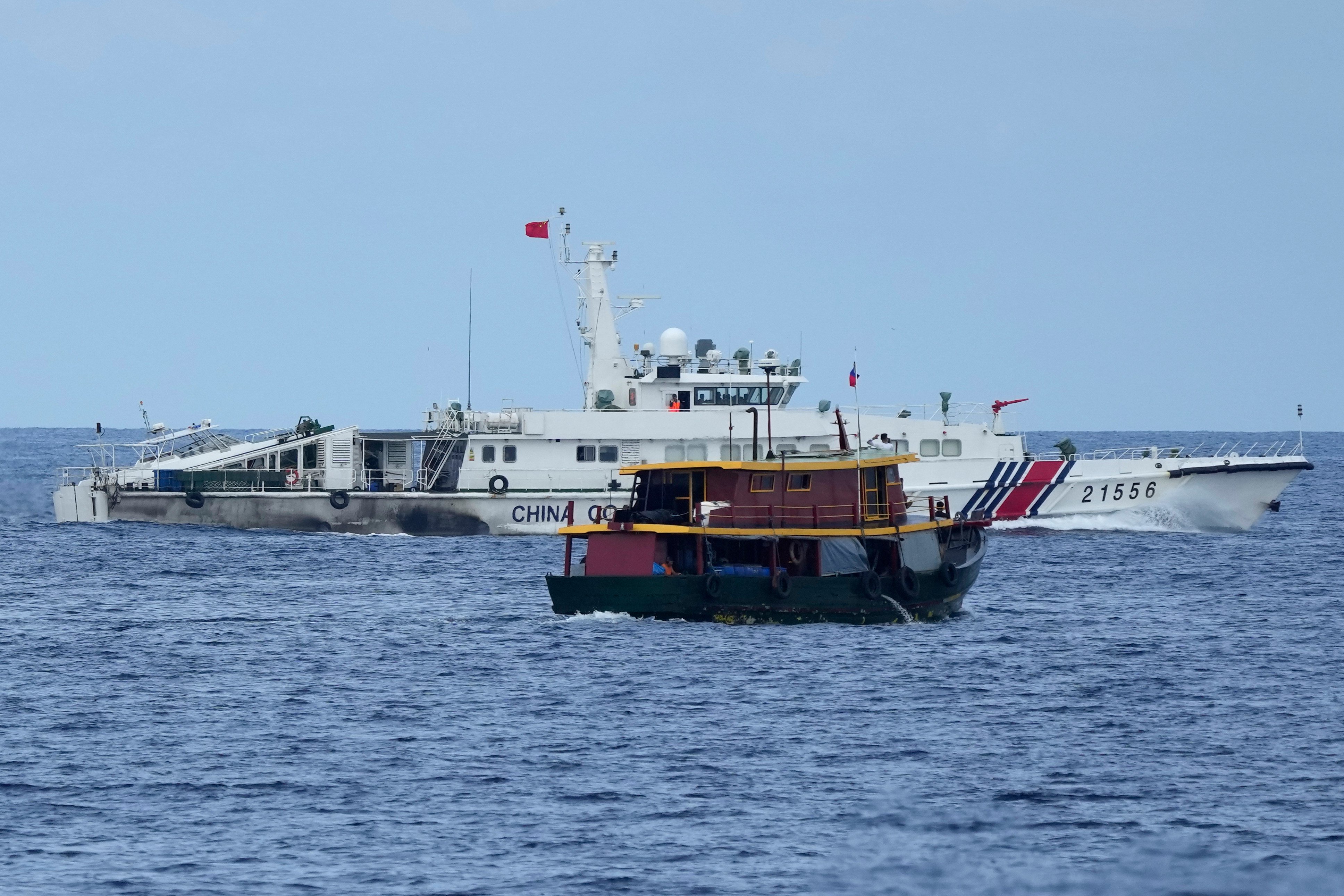 A Chinese coastguard vessel tries to block a Philippine supply boat as it heads towards Second Thomas Shoal, locally known as Ayungin Shoal, at the disputed South China Sea in August. Photo: AP