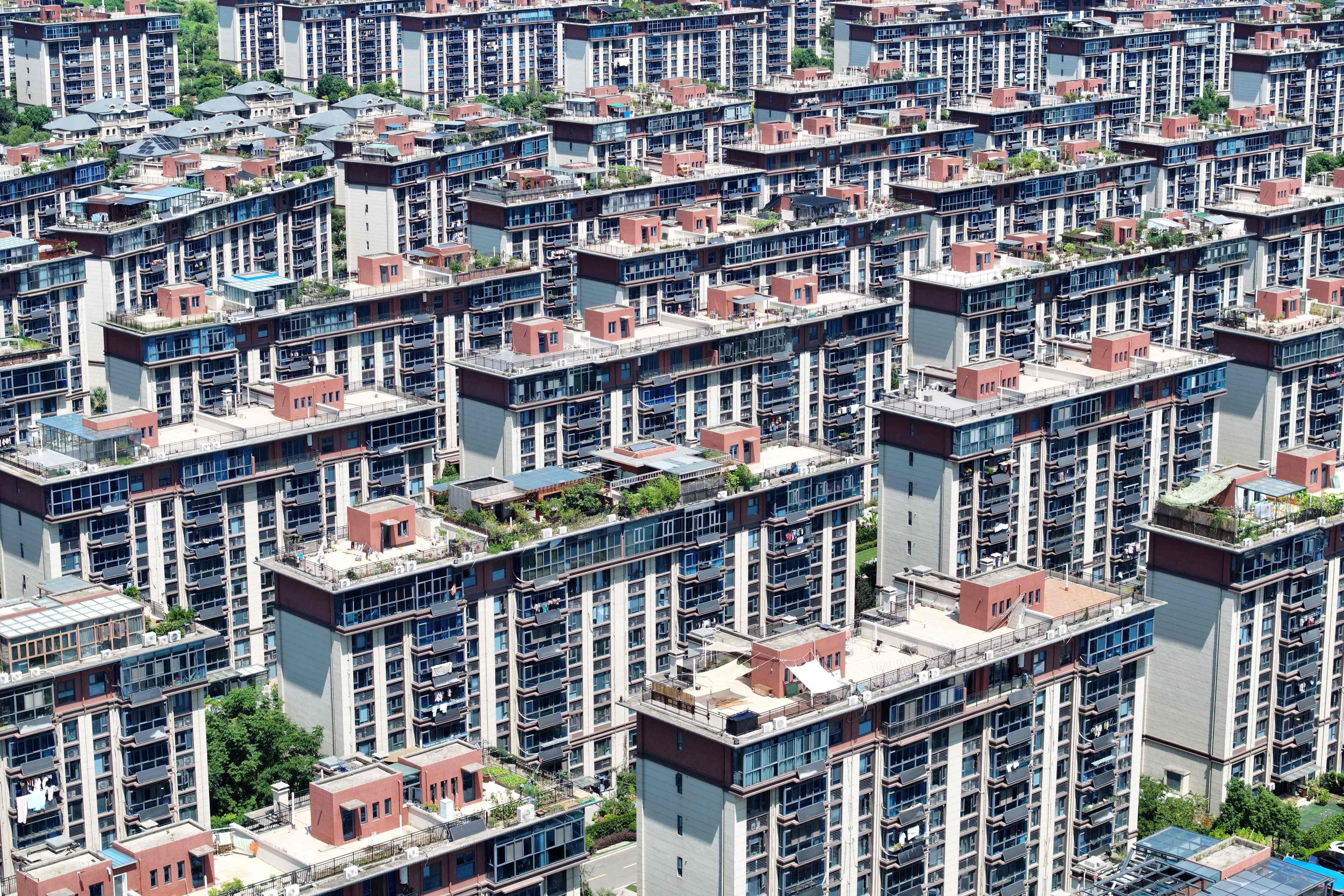 China, with 1.4 billion people, has issued more than 790 million real estate certificates in the past decade. Photo: AFP