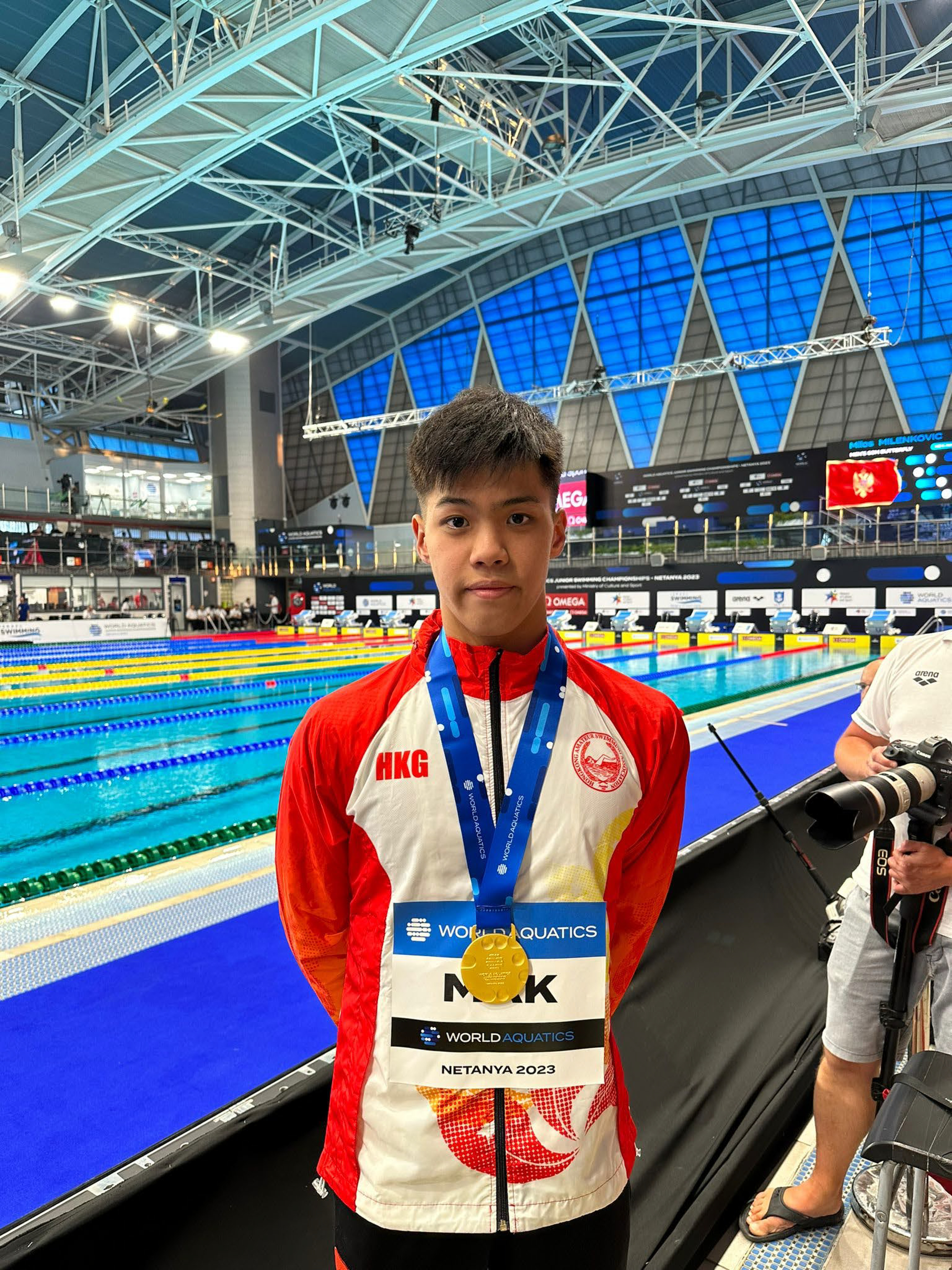 Adam Mak with his gold medal at the World Aquatics Junior Swimming Championships. Photo: Handout