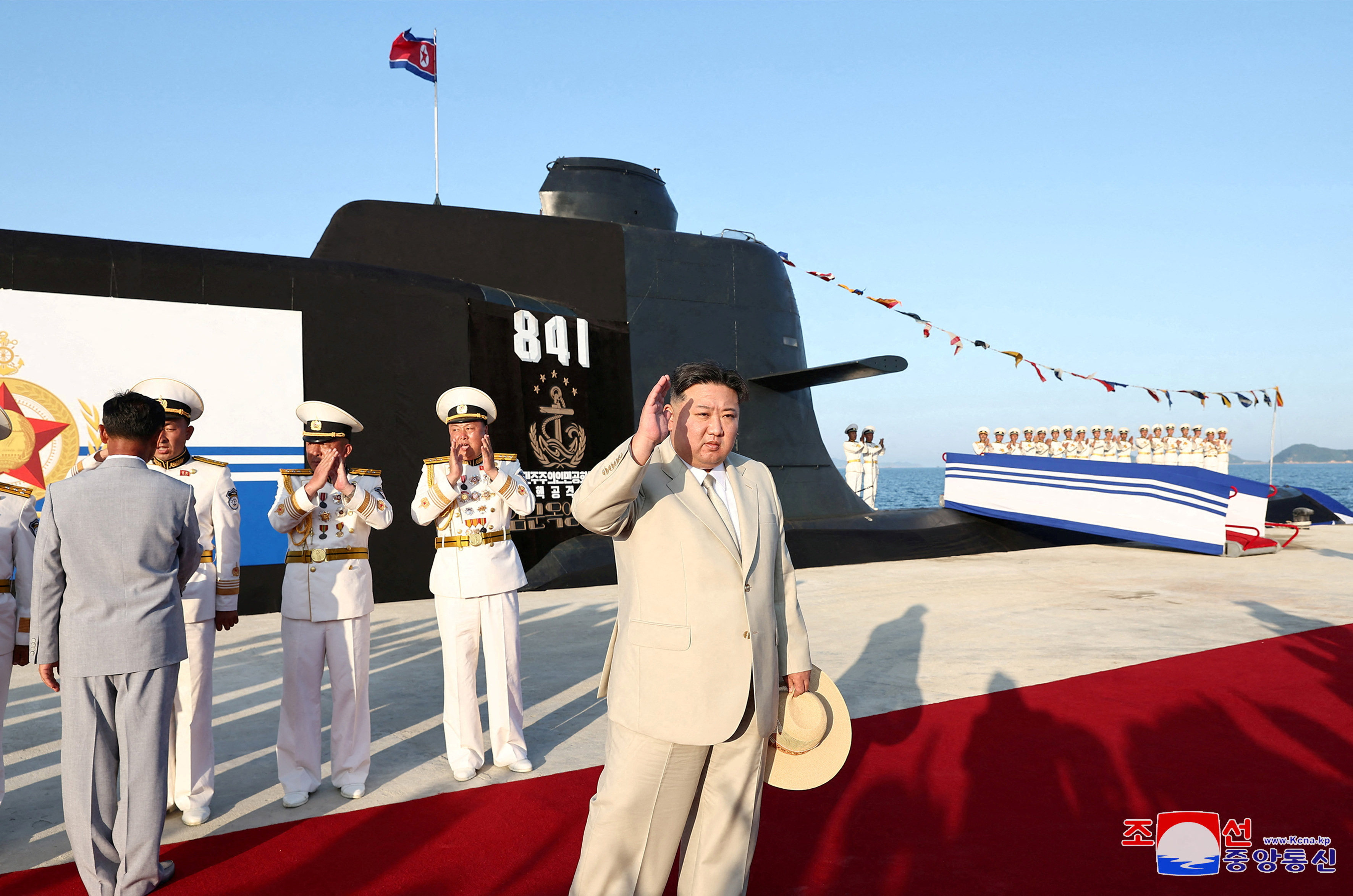 North Korean leader Kim Jong-un attends the launching ceremony for what state media reported was a new tactical nuclear attack submarine. Photo: KCNA via Reuters
