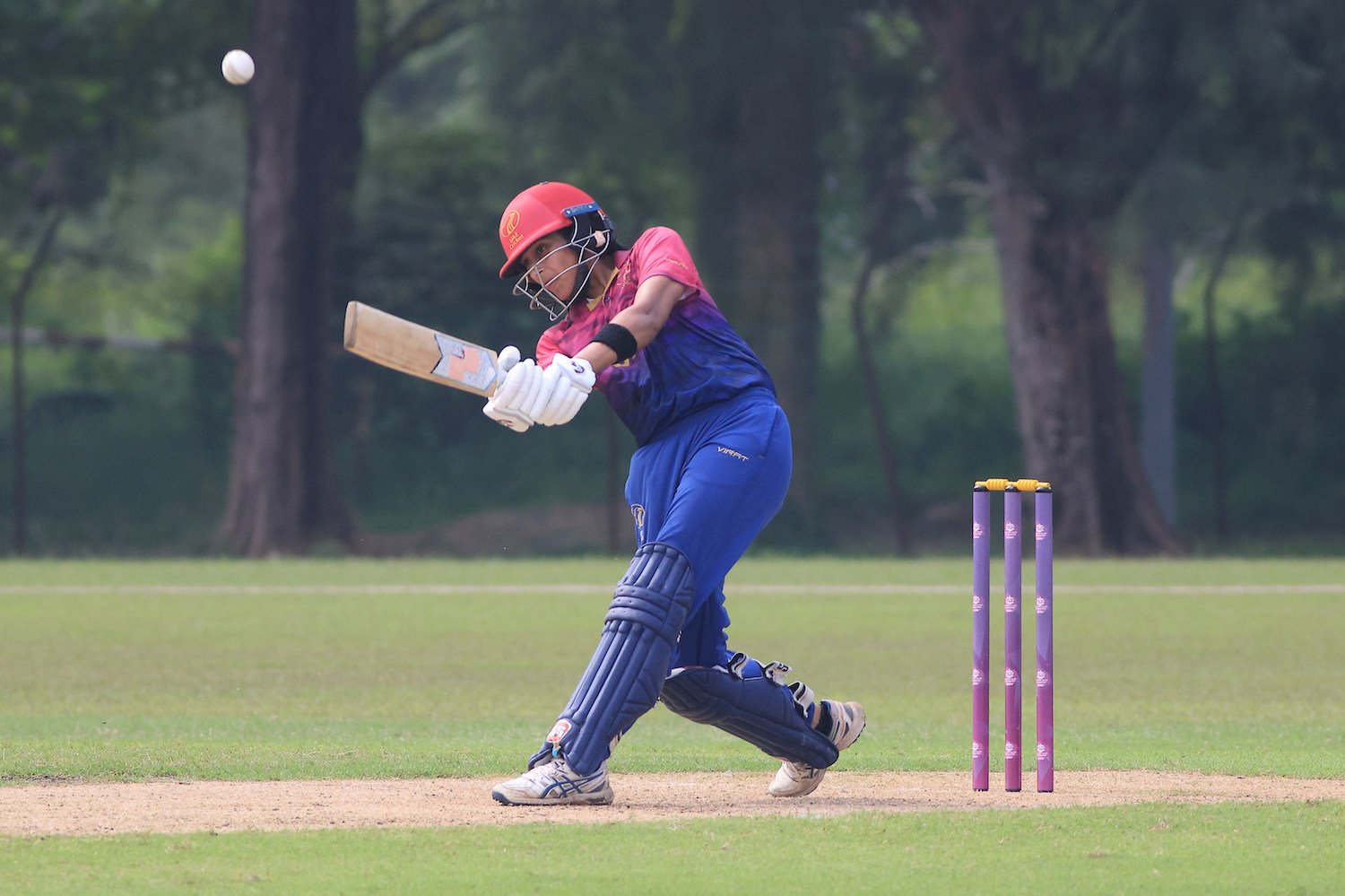 UAE Opener Esha Oza hits the ball into the leg side for four during her side’s ICC Women’s T20 World Cup Asia Qualifier semi-final against Hong Kong at Bayuemas Oval. Photo: ICC