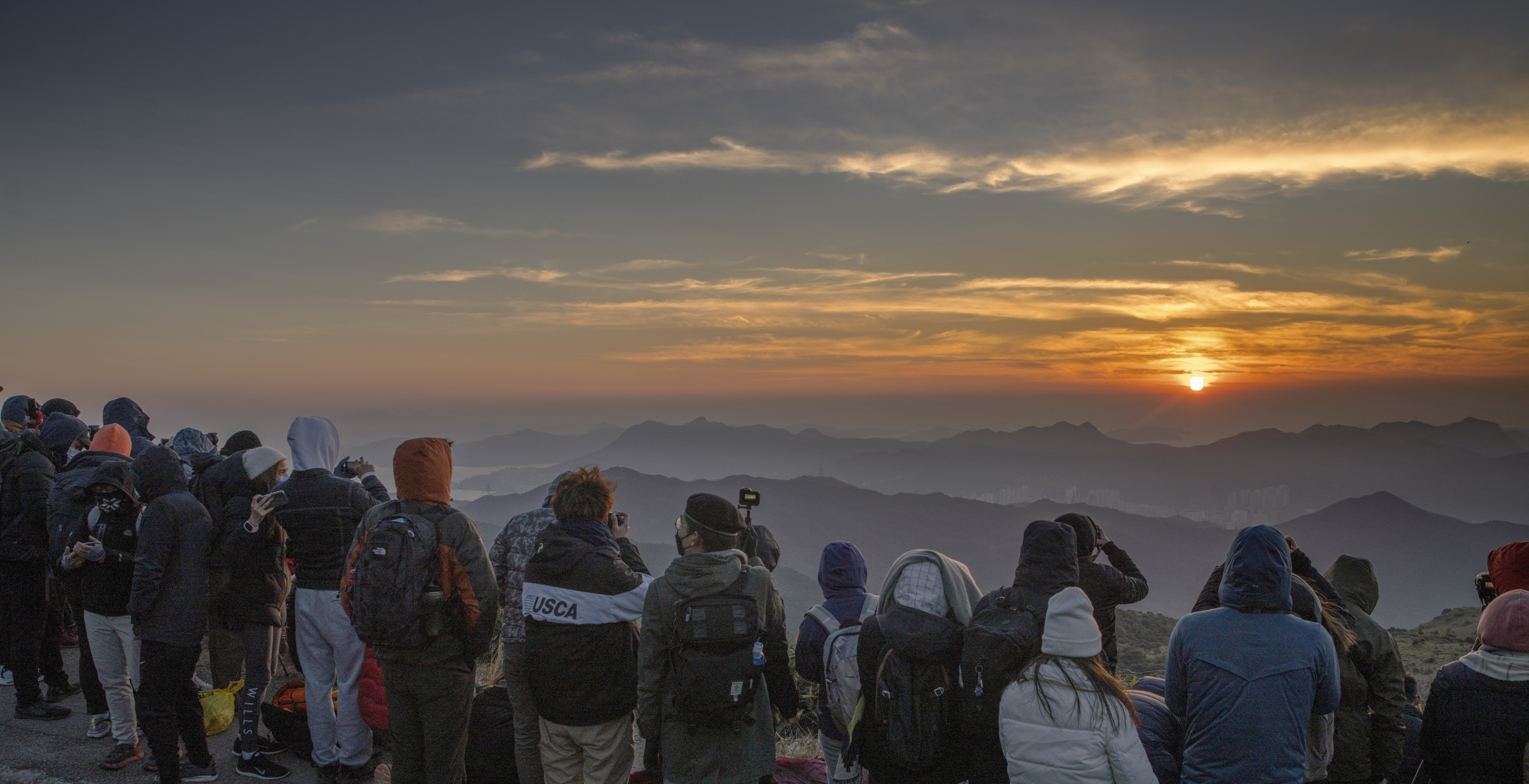 People flock to Tai Mo Shan to catch the first sunrise of the year on January 1, 2021. The pandemic heightened stress and anxiety, and its impacts are still being felt. Photo: Winson Wong