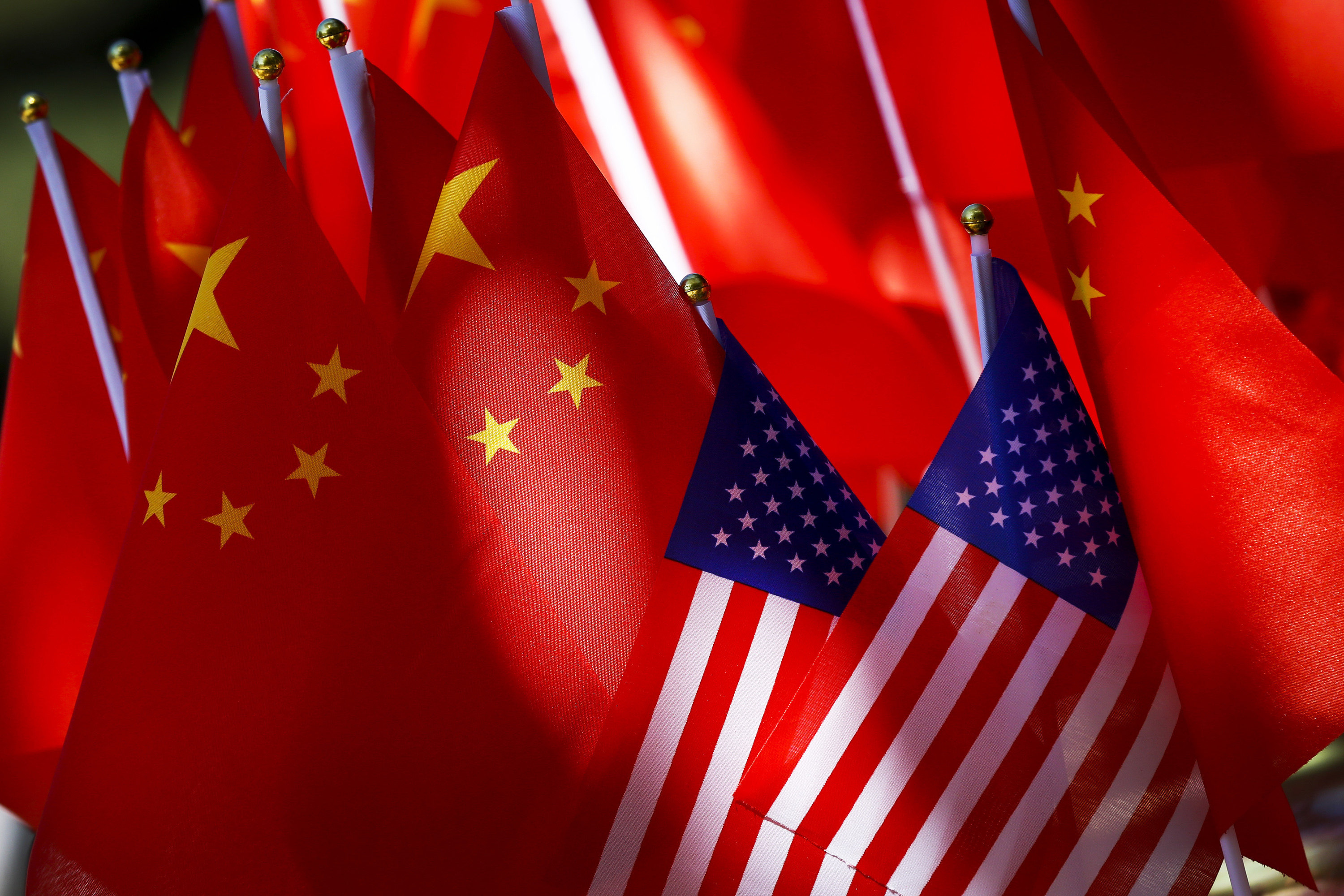 The flags of the U.S. and Chinese are displayed together. Photo: AP