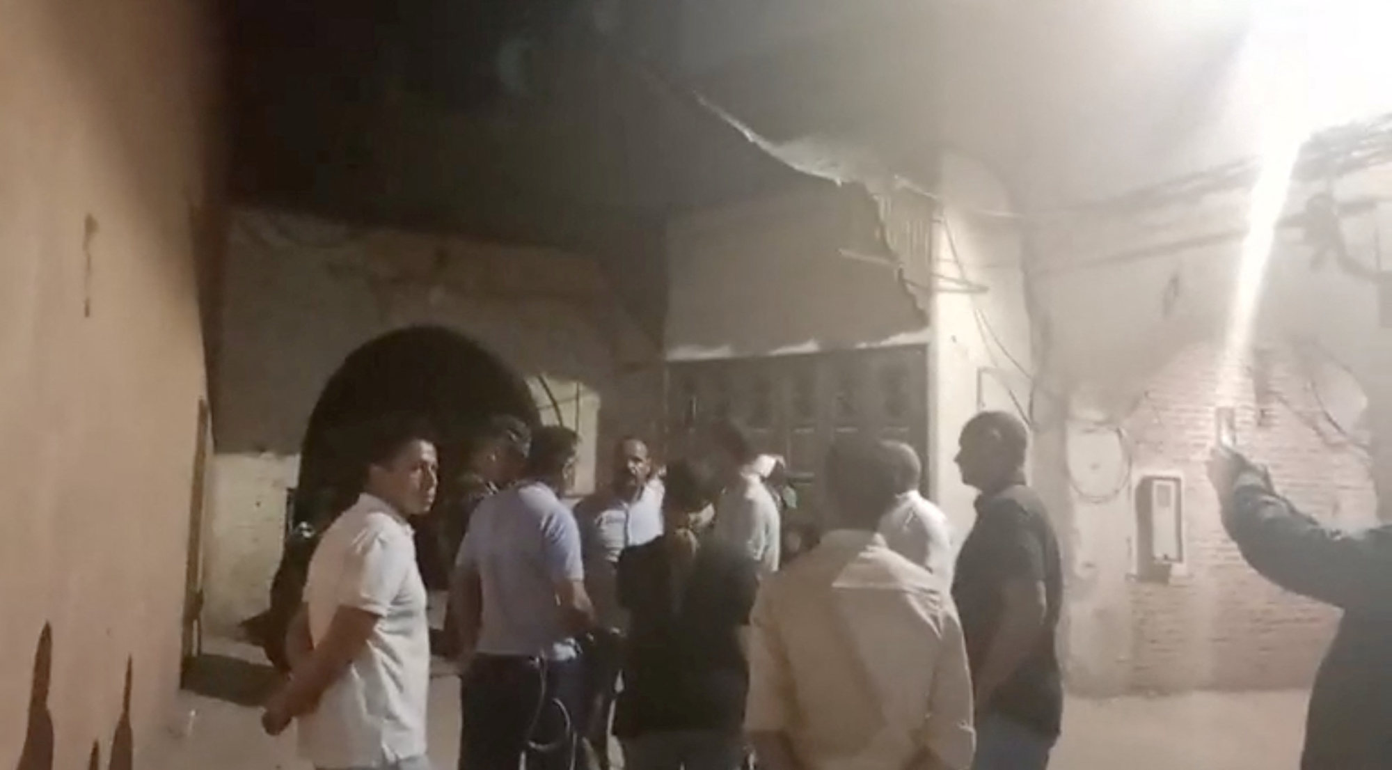 People look at the damage caused by an earthquake in Marrakech, Morocco, on Saturday. Photo: Al Maghribi Al Youm via Reuters