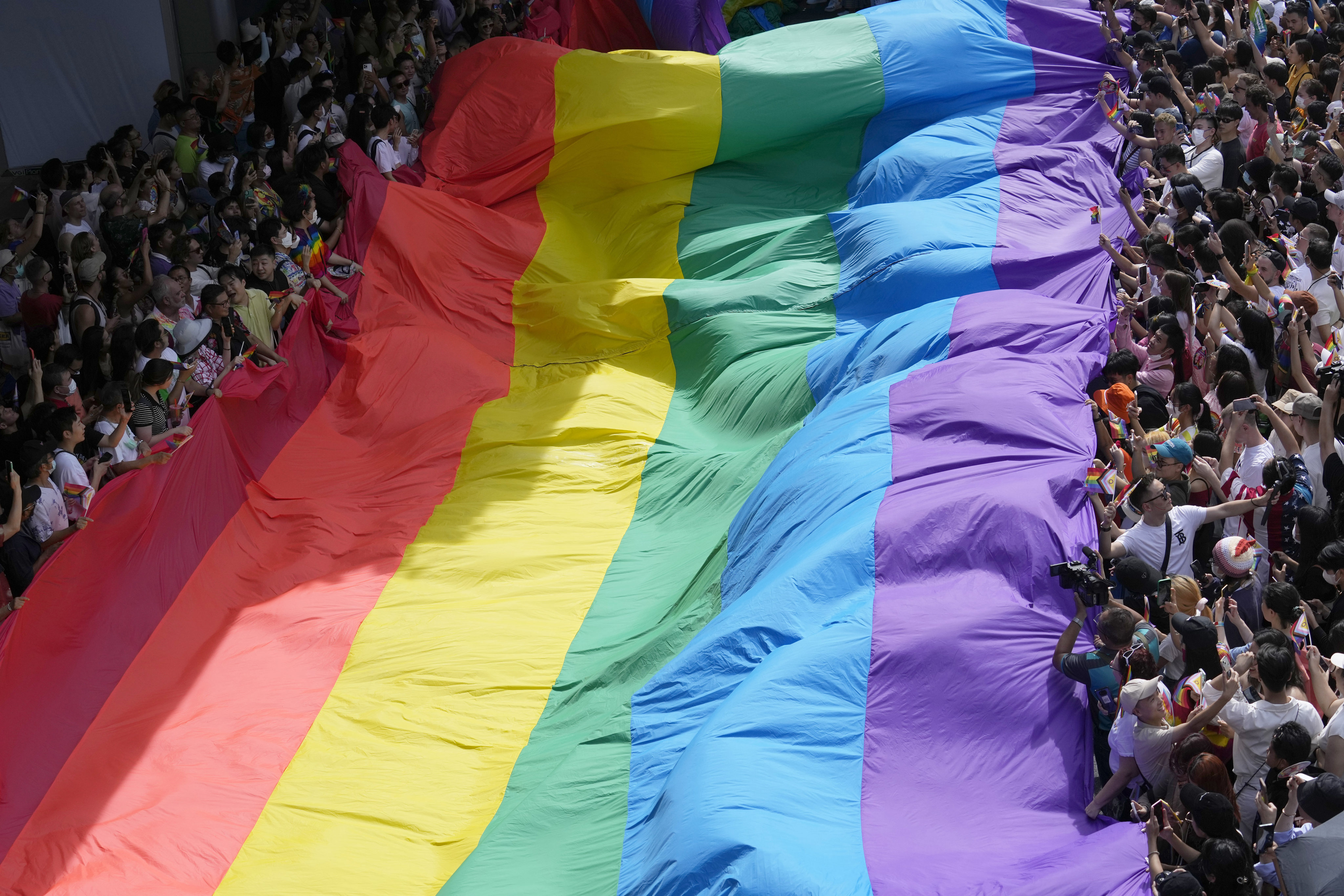 Participants hold a rainbow flag during the Pride Parade in Bangkok, Thailand, June 4, 2023. Photo: AP Photo