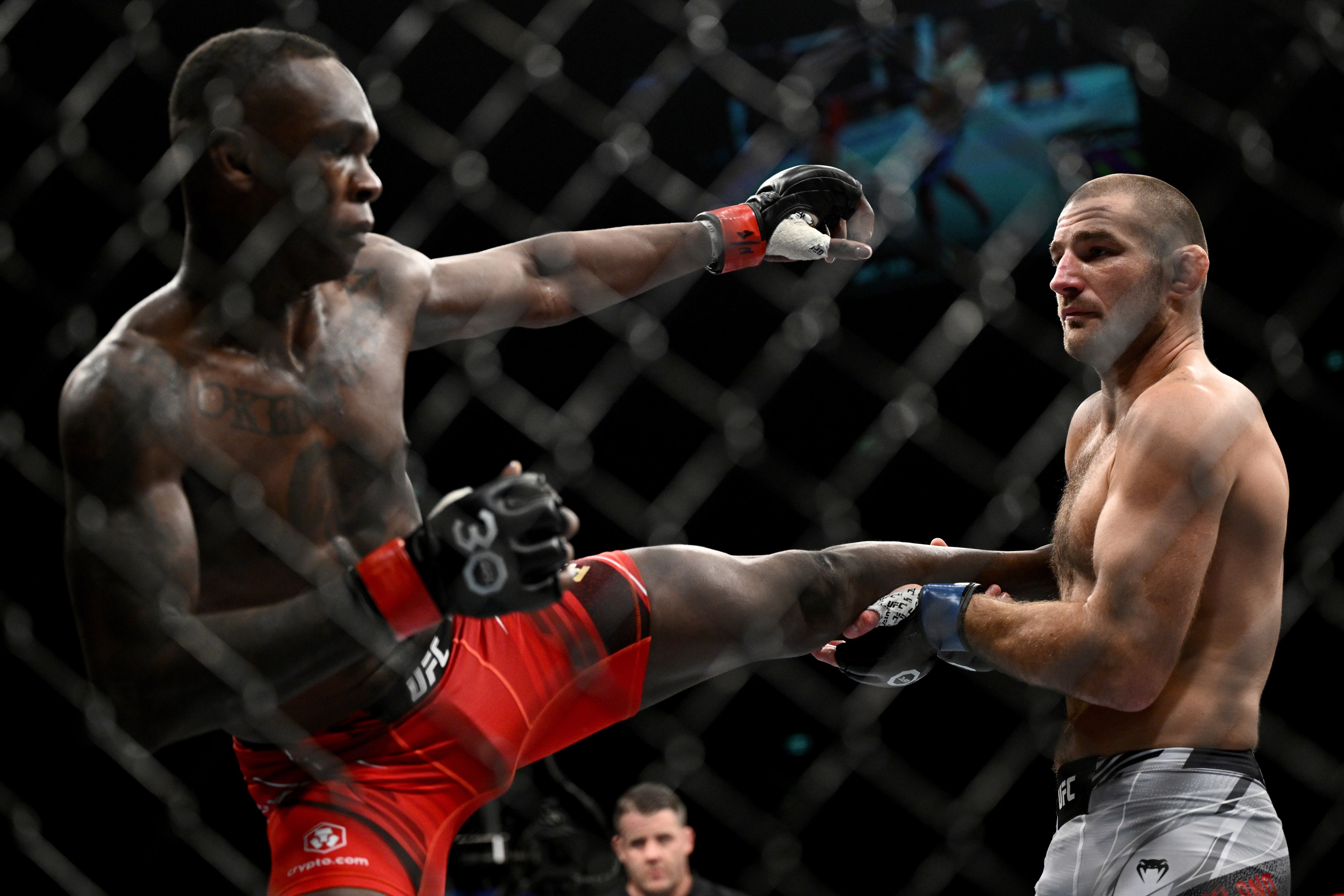 Israel Adesanya and Sean Strickland in action during the UFC 293 main event in Sydney. Photo: EPA-EFE