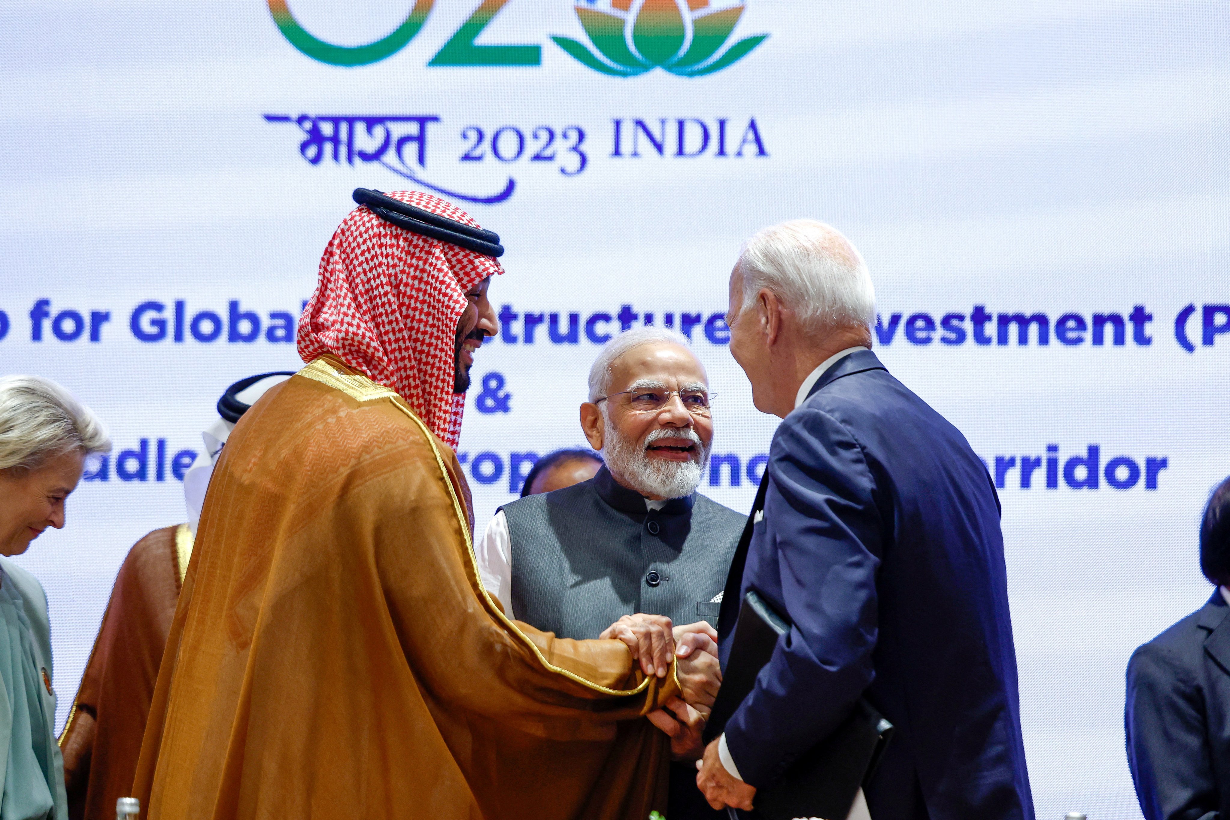 Saudi Arabian Crown Prince Mohammed bin Salman Al Saud and US President Joe Biden shake hands next to Indian Prime Minister Narendra Modi at the G20 summit in New Delhi on Saturday. Photo: Reuters