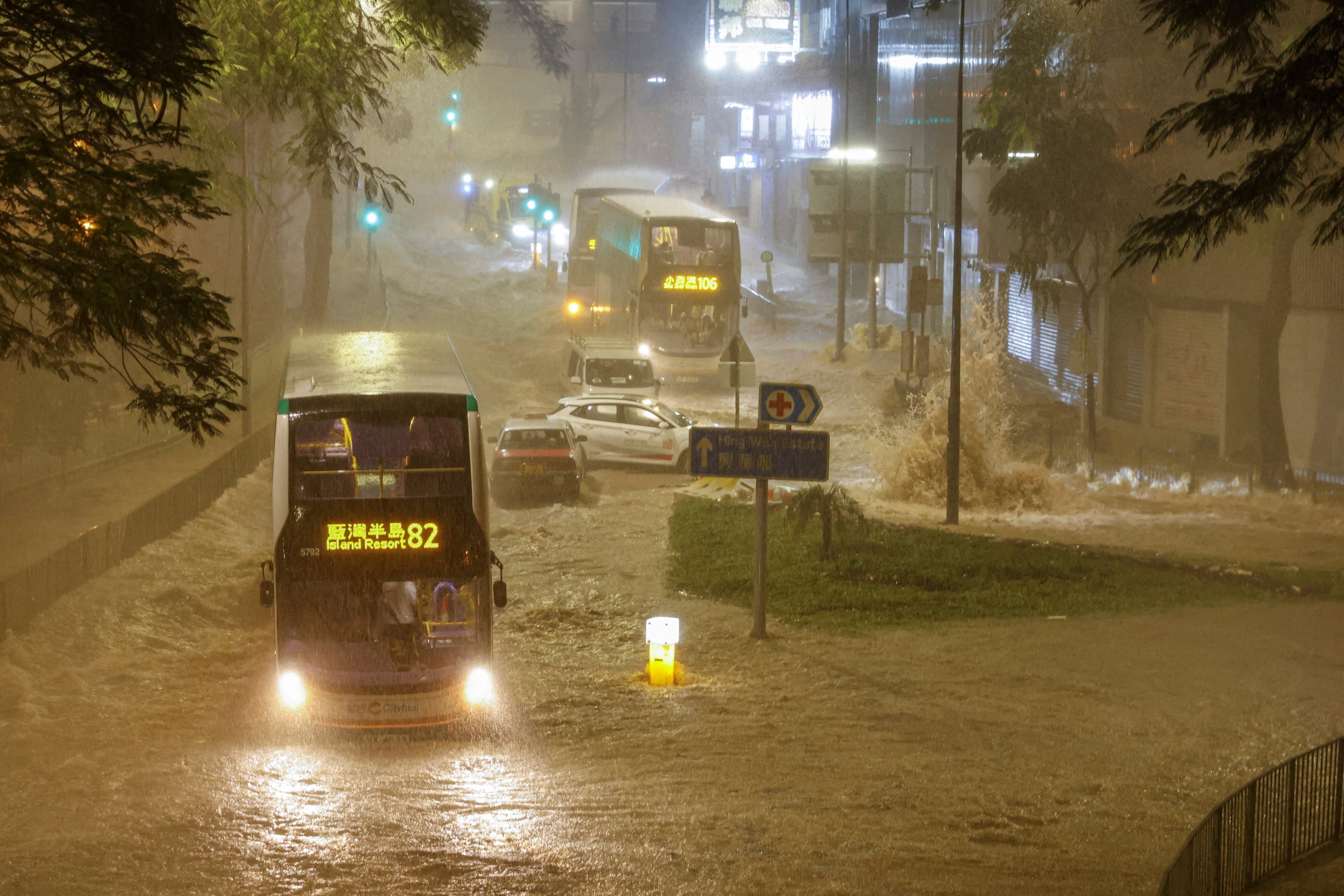 A bus drives through a flooded area during heavy rain in Hong Kong on September 8. Photo: Reuters