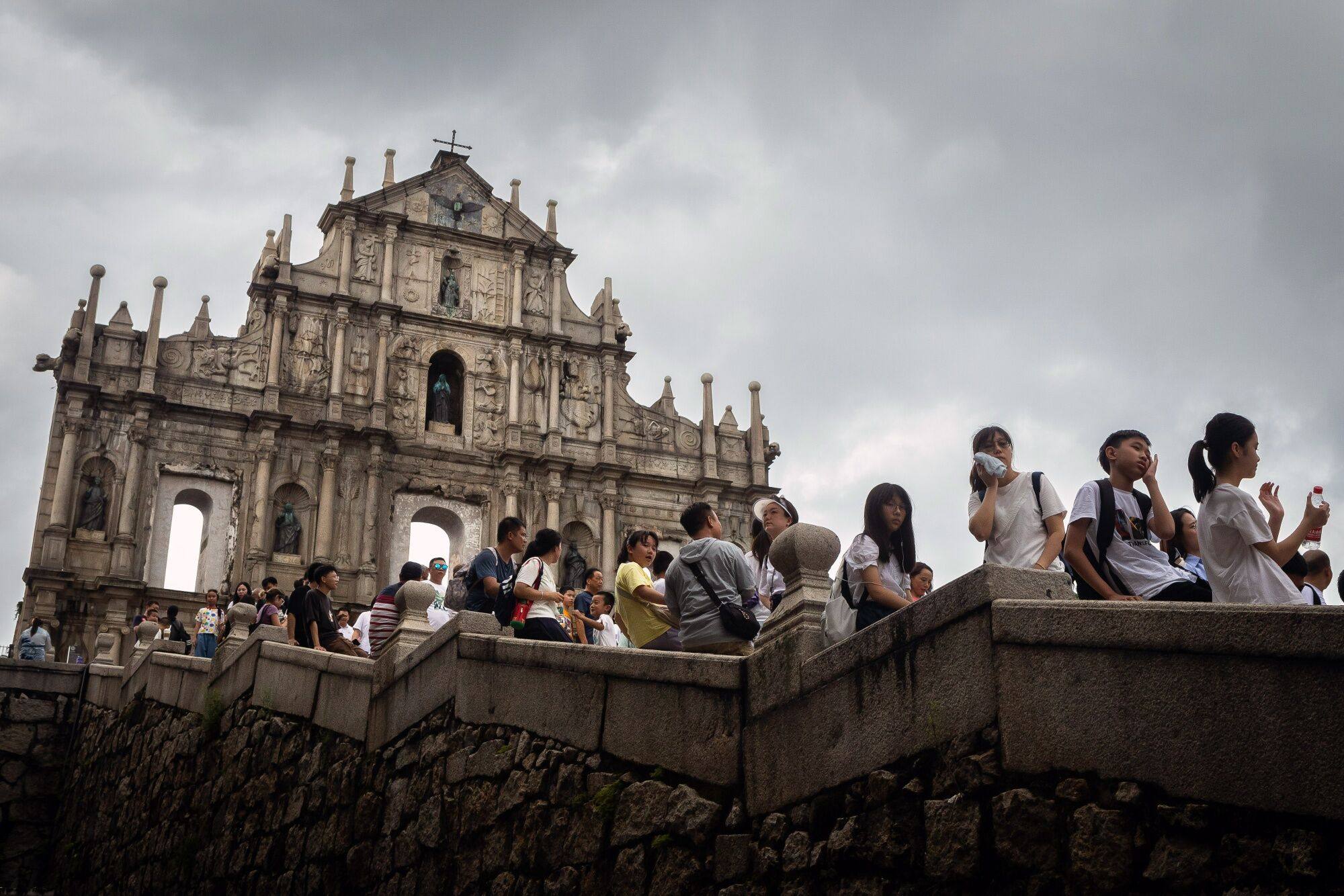 A file photo of visitors at the Ruins of St. Paul’s in Macau from last month. In the first half of 2023, China’s travel sector raked in total revenues of 2.3 trillion yuan (US$315.2 billion), up 96 per cent year on year, according to Ministry of Culture and Tourism data. Photo: Bloomberg