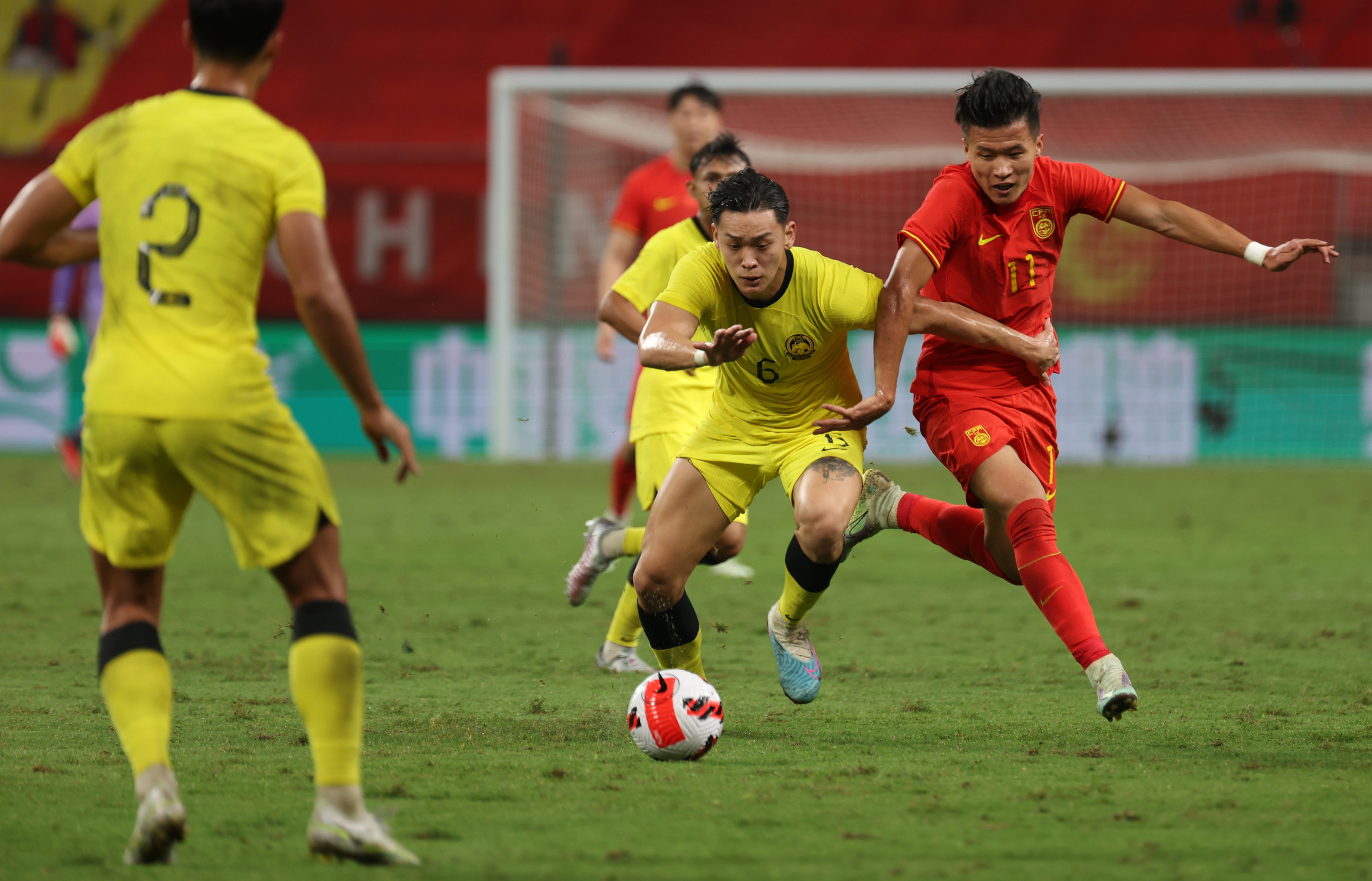 Lin Liangming (right) spared China’s blushes with a first-half equaliser against Malaysia. Photo: Xinhua
