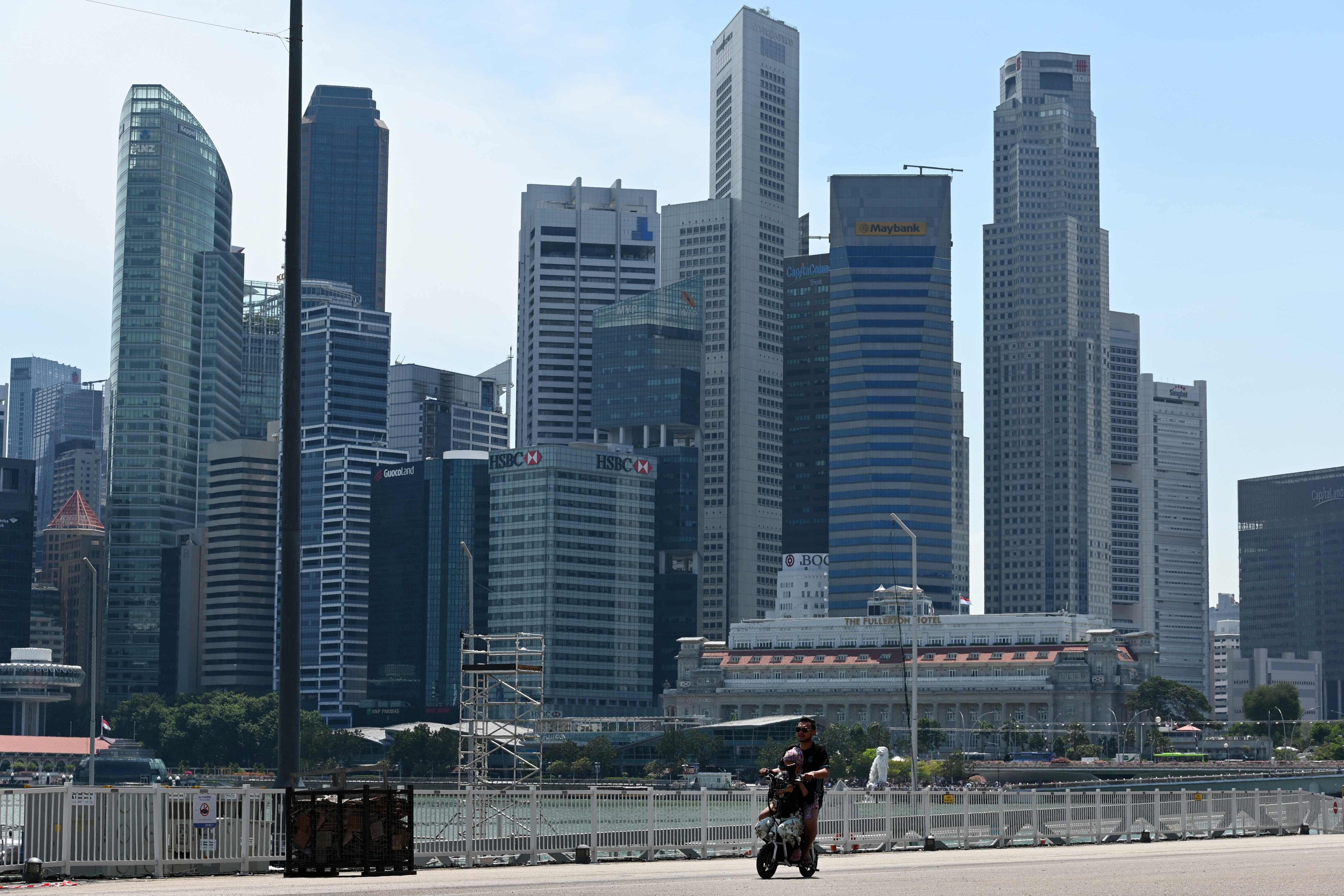 A couple ride on an e-scooter in Marina Bay. The “freak accident” involving the jaywalker and the motorcyclist occurred on Yishun Avenue 1 in northern Singapore. Photo: AFP