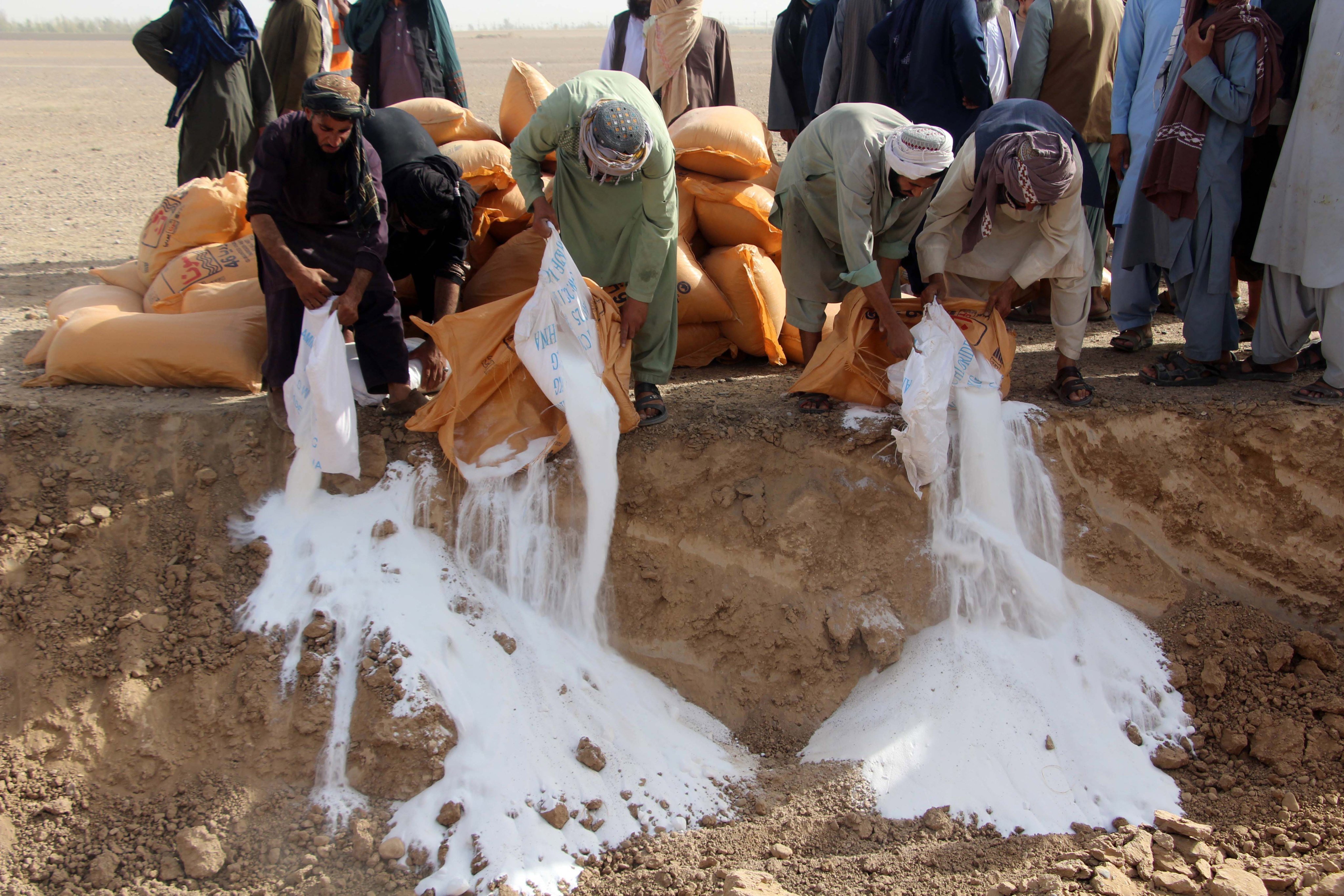 Afghan officials destroy narcotics and other illegal substances during a ceremony in Kandahar, Afghanistan. Photo: EPA-EFE