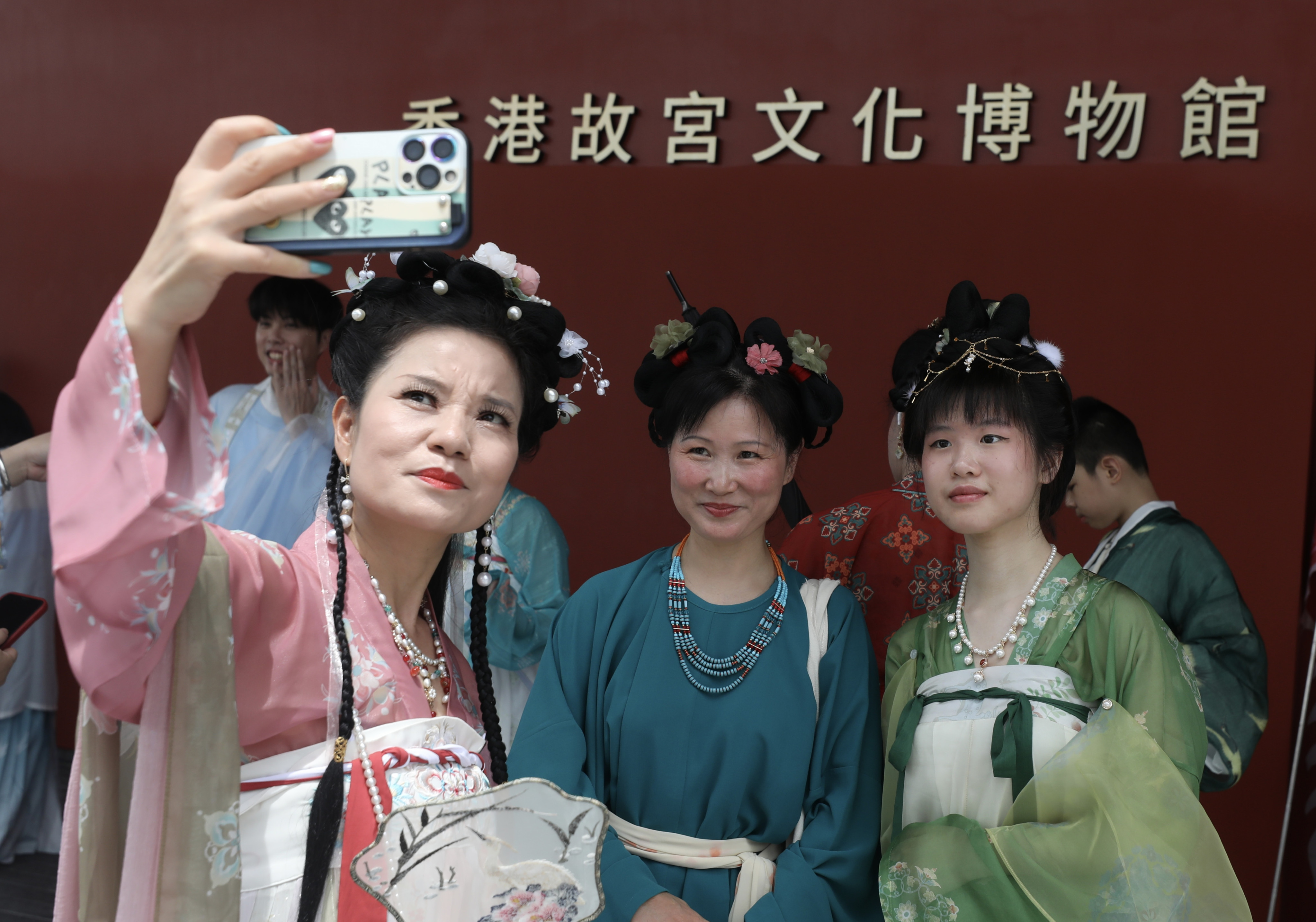 A group of Chinese nationalists clad in traditional ‘Huafu’ costume celebrate the July 1st Hong Kong Handover anniversary outside in the Palace Museum in West Kowloon. Rising nationalism in China has spurred increasing interest in Han clothing styles amid rising intolerance for some other types of dress. Photo: SCMP / Xiaomei Chen