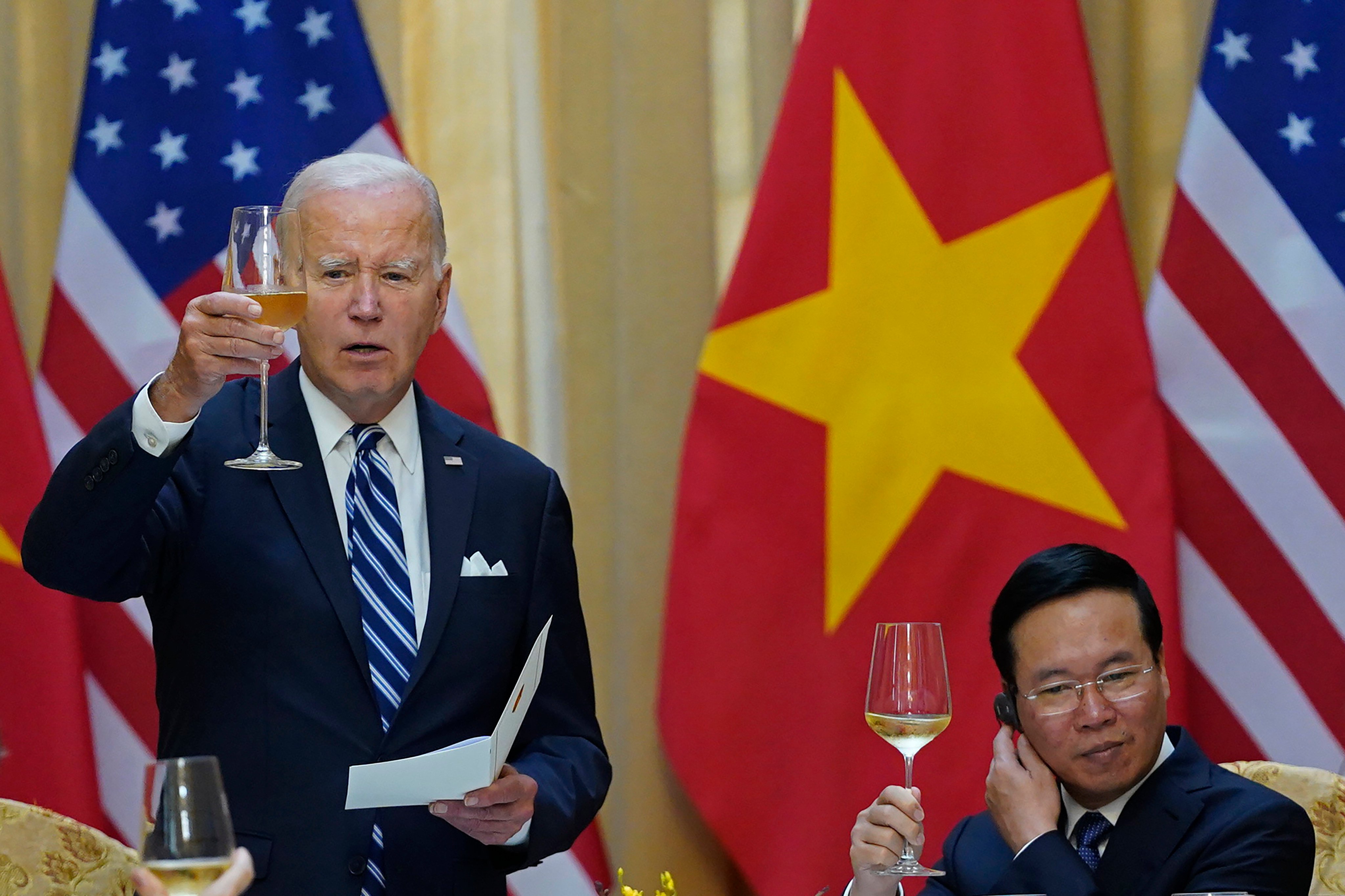US President Joe Biden raises a toast alongside Vietnam President Vo Van Thuong in Hanoi on Monday. Photo: AP 