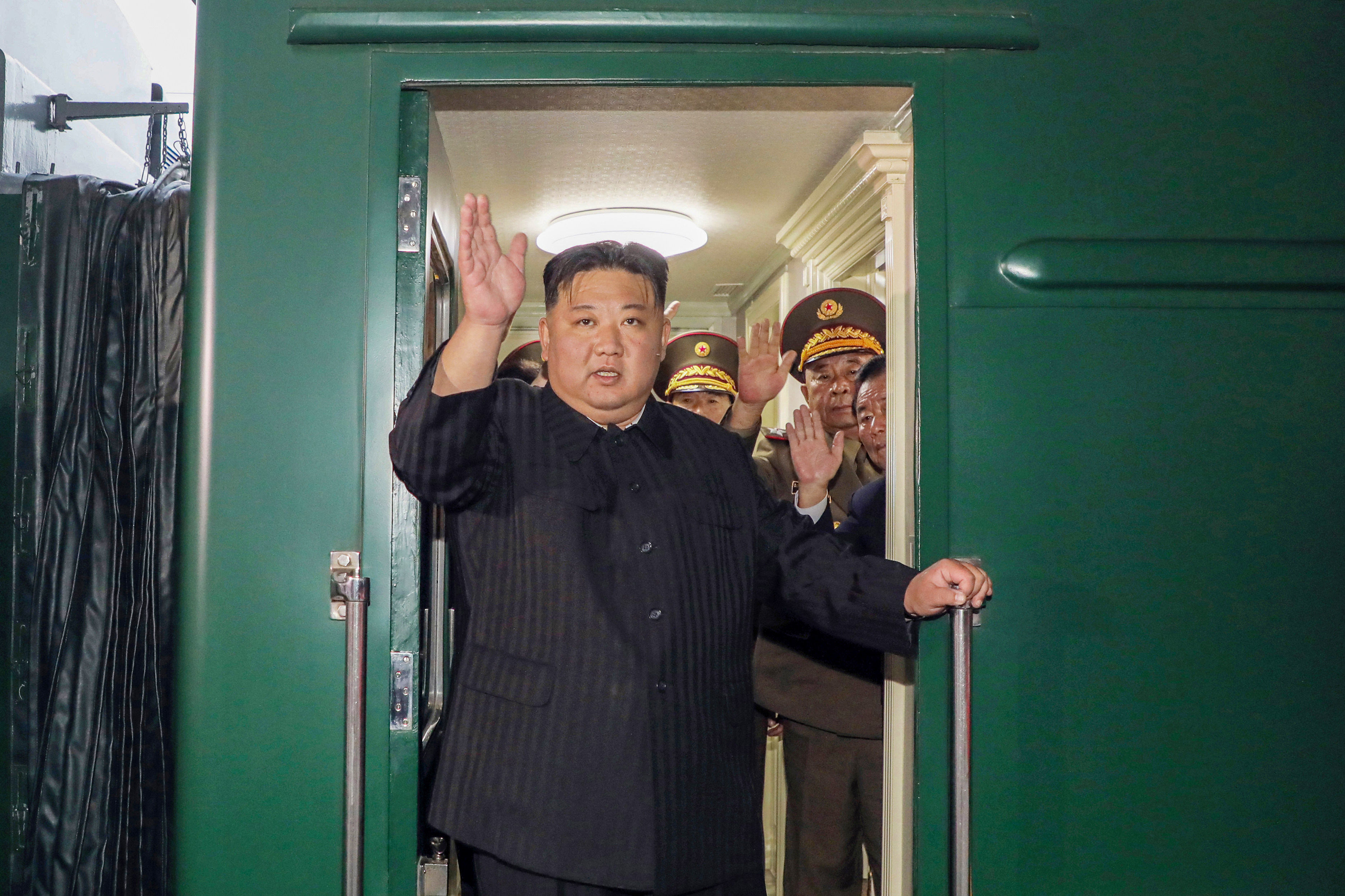 North Korean leader Kim Jong-un waves as he boards a train in Pyongyang on Sunday to hold talks with Russian President Vladimir Putin. Photo: KCNA/dpa