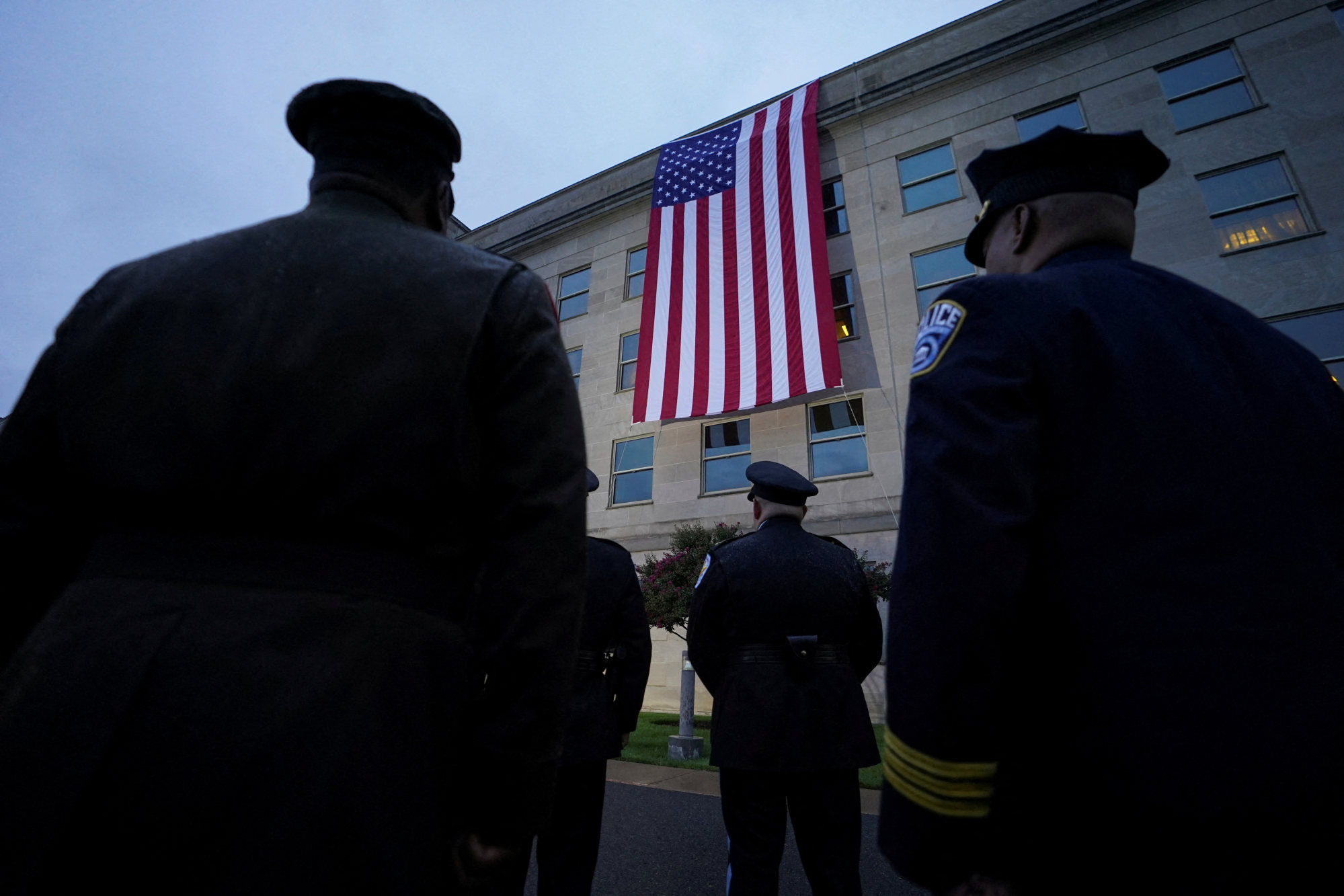 A US flag is unfurled from the Pentagon roof to mark the 22nd anniversary of September 11 attacks. Photo: Reuters