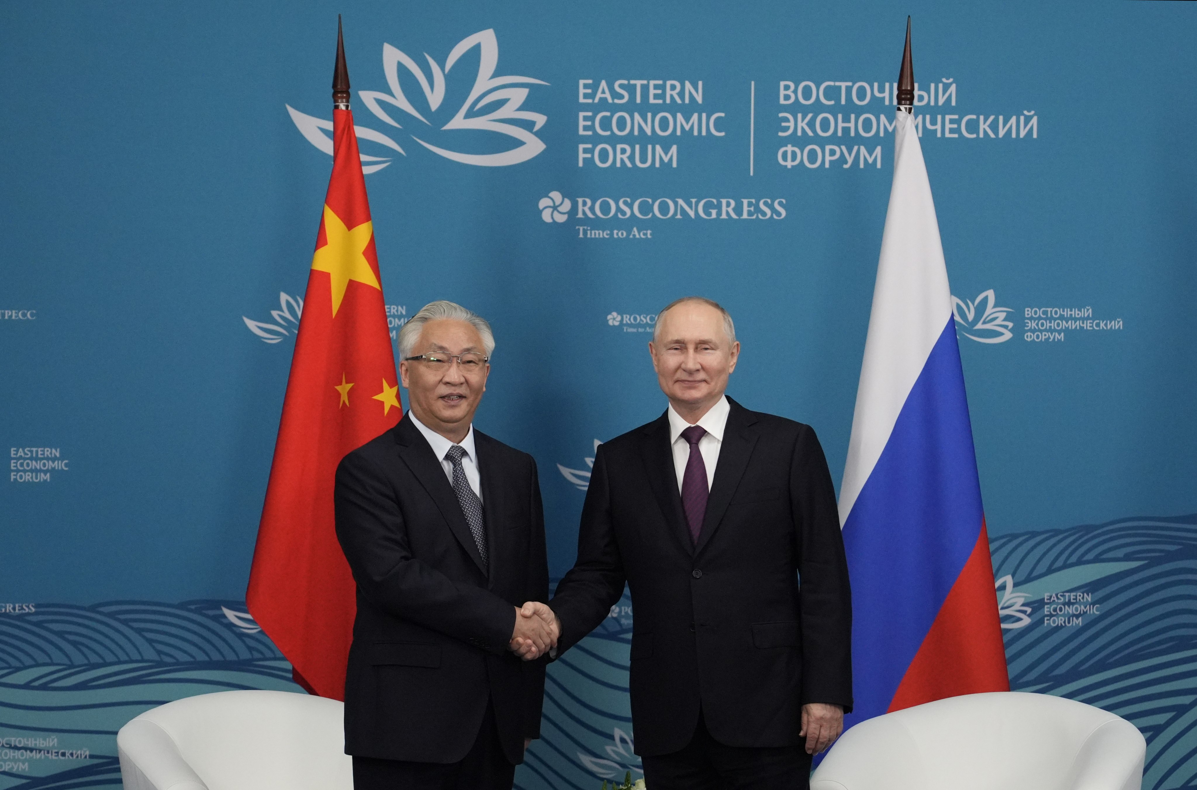 Russian President Vladimir Putin (right) poses with Chinese Vice-Premier Zhang Guoqing at the Eastern Economic Forum in Vladivostok, Russia, on Tuesday. Photo: EPA-EFE