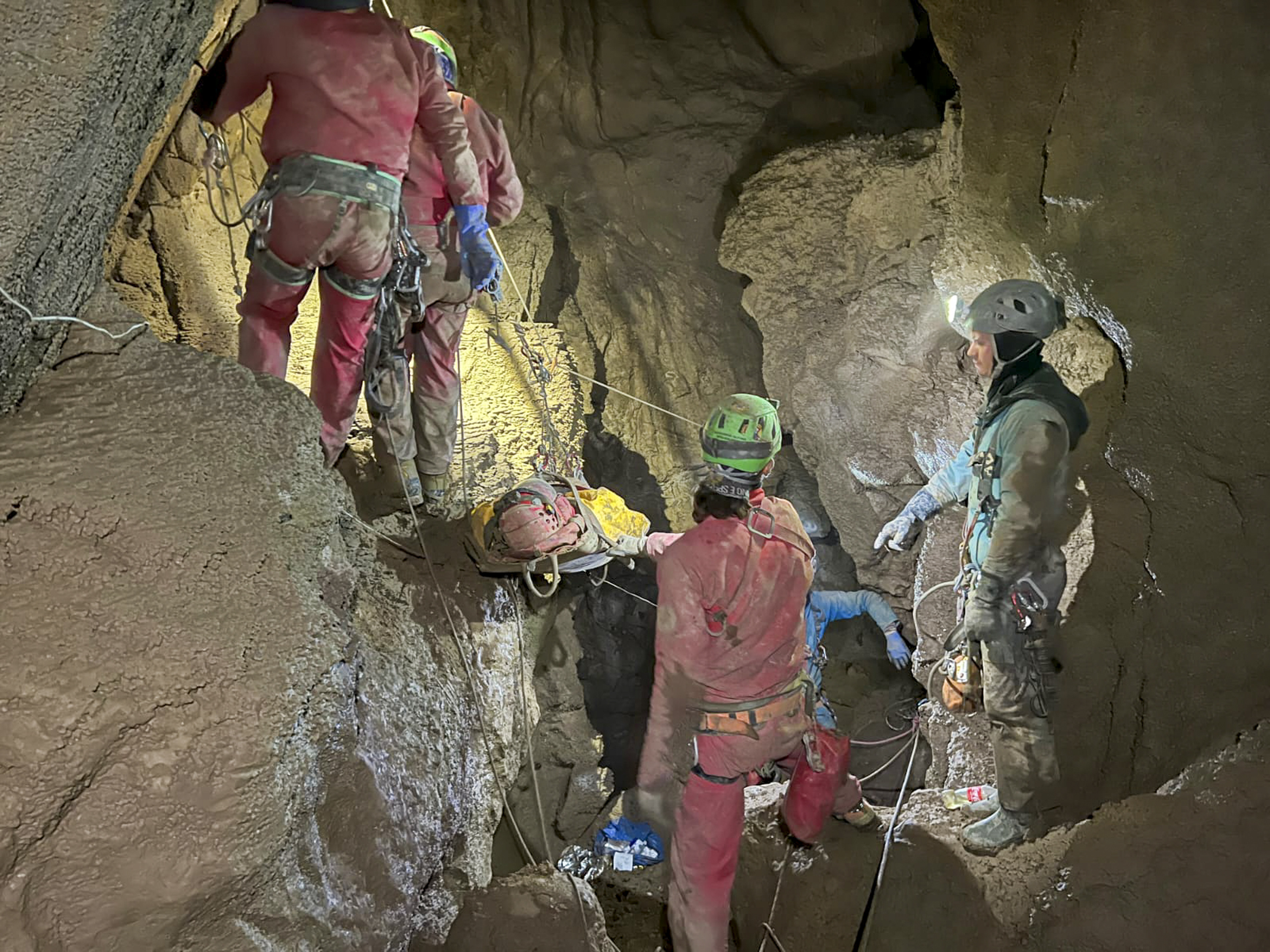 Members of the CNSAS, Italian alpine and speleological rescuers, carry a stretcher with American researcher Mark Dickey during a rescue operation in the Morca cave near Anamur, southern Turkey on Monday. Photo: CNSAS via AP