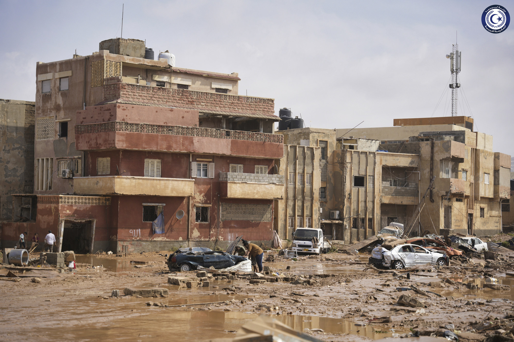 Cars and rubble in a street in Derna, Libya. Photo: Libyan government via AP
