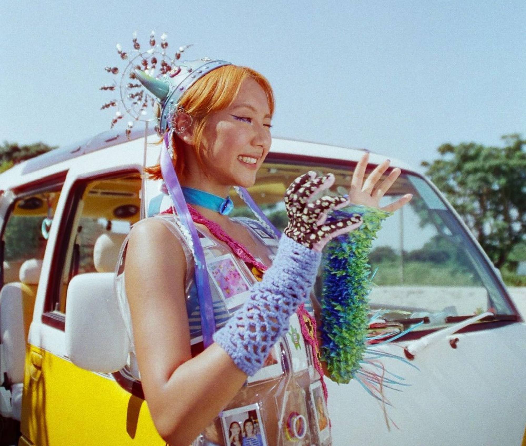 Marf Yau wearing a bright, textured ensemble in her music video Fool. Photo: @_marifemarife_/Instagram