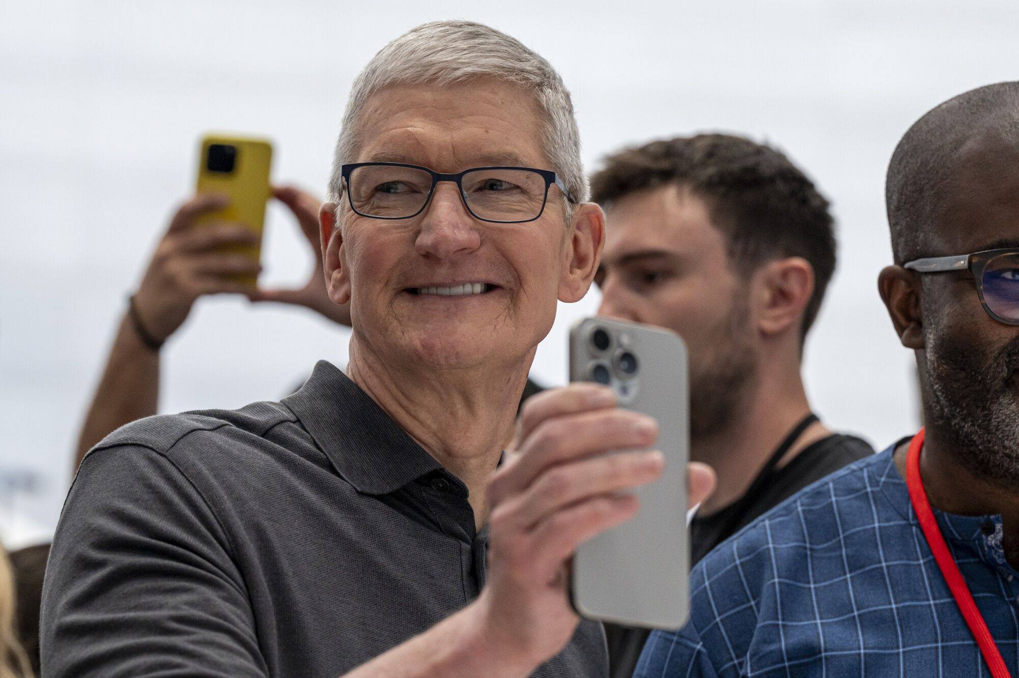 Apple chief executive Tim Cook holds an iPhone 15 Pro Max during the company’s launch of its new flagship smartphone models at the Apple Park campus in Cupertino, California, on September 12, 2023. Photo: Bloomberg