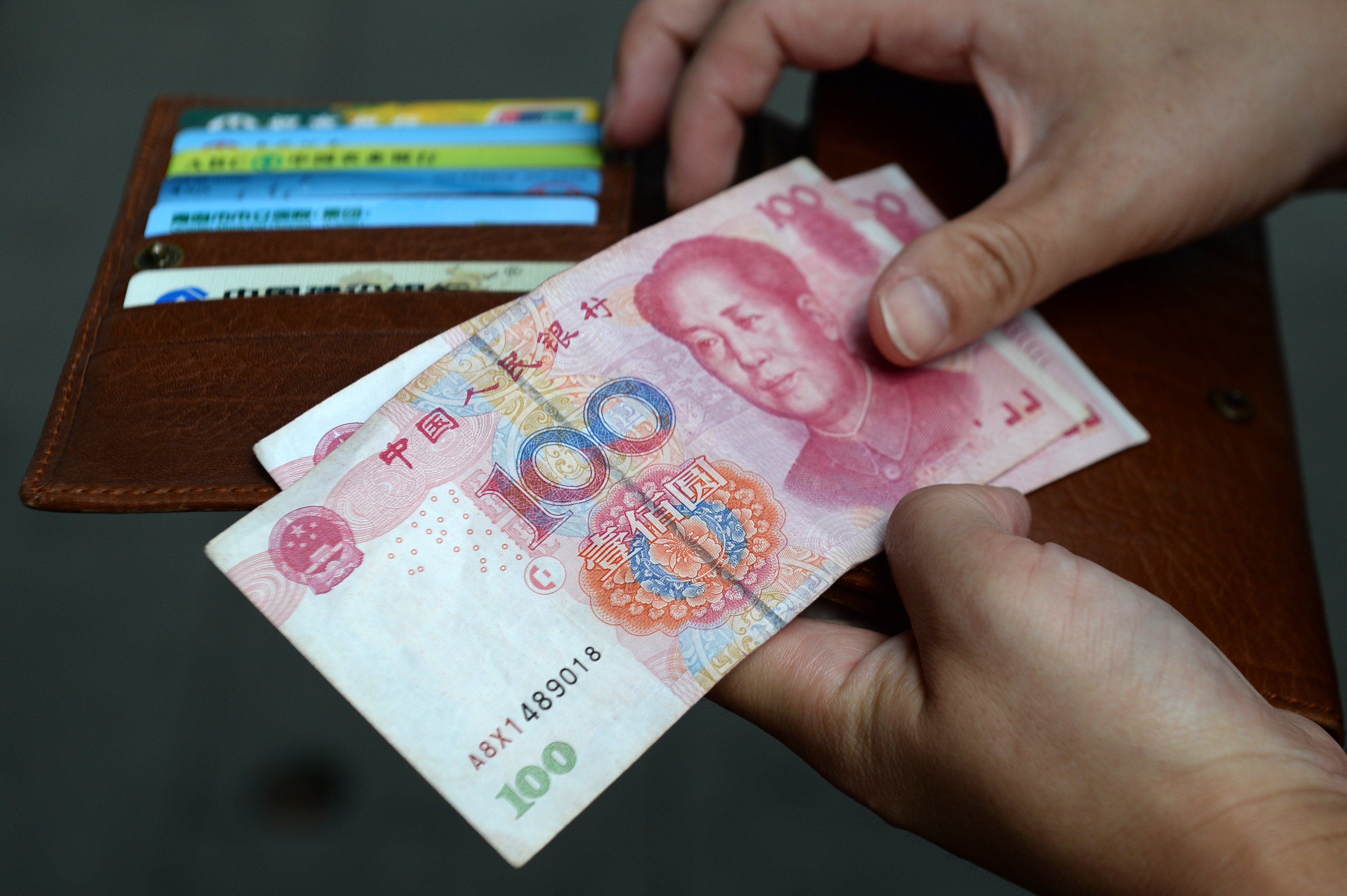 it is getting more expensive for traders to borrow the Chinese currency in the overseas market and sell it against the dollar. Photo: dpa