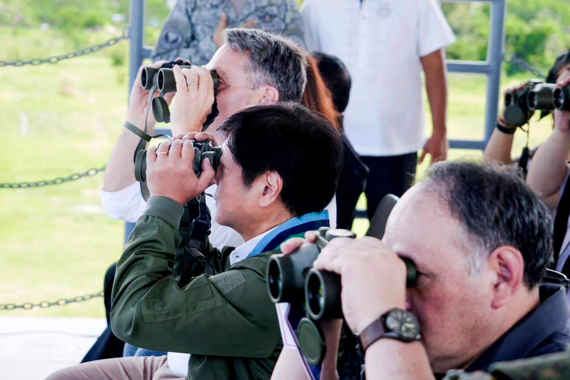 Australian Defence Minister Richard Marles (left) and Philippine President Ferdinand Marcos Jnr watch joint military drills through binoculars on August 25 at a naval base in San Antonio, Zambales. Joint patrols are expected to raise tensions in the South China Sea, most of which China claims. Photo: AP