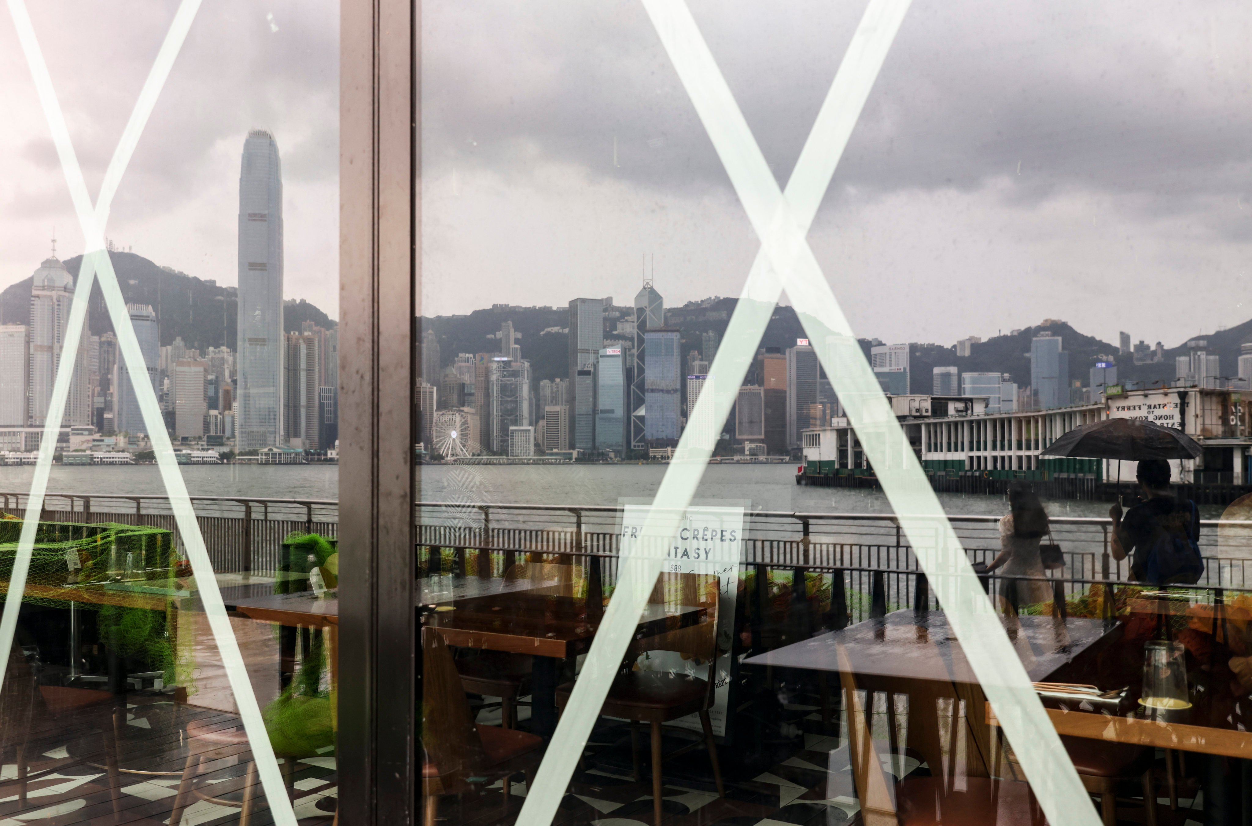 Hong Kong Island is reflected in taped windows in Tsim Sha Tsui as super typhoon Saola hit the city on September 1, 2023. Photo: Yik Yeung-man