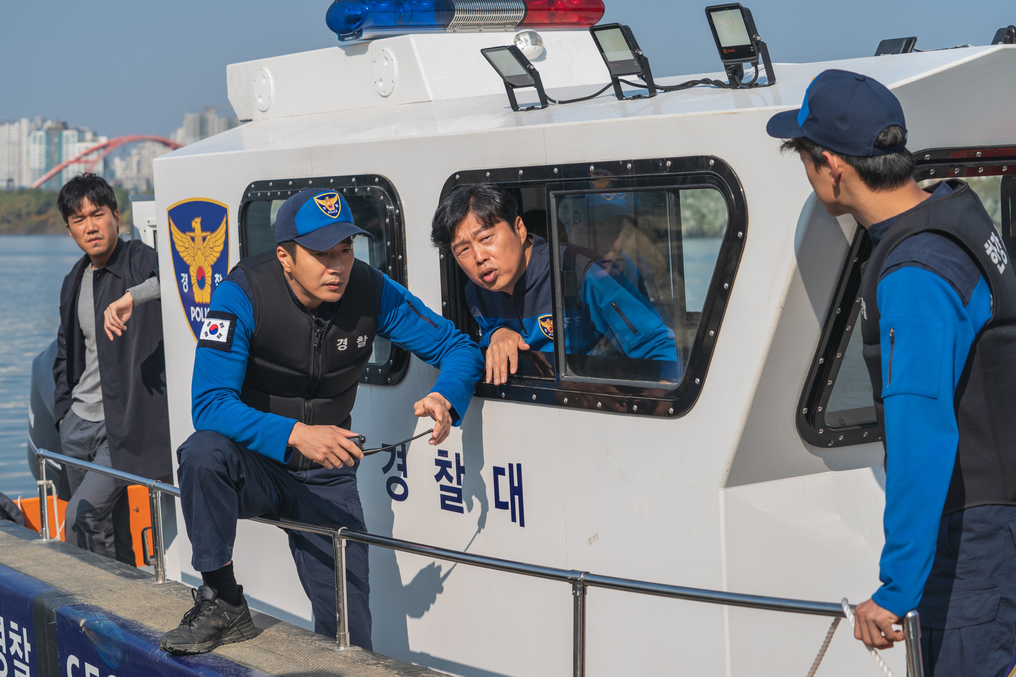 Kwon Sang-woo (left) as river policeman Han Du-jin and Kim Hee-won as fellow officer Lee Cheon-seok in a still from “Han River Police” on Disney+. Photo: Disney+