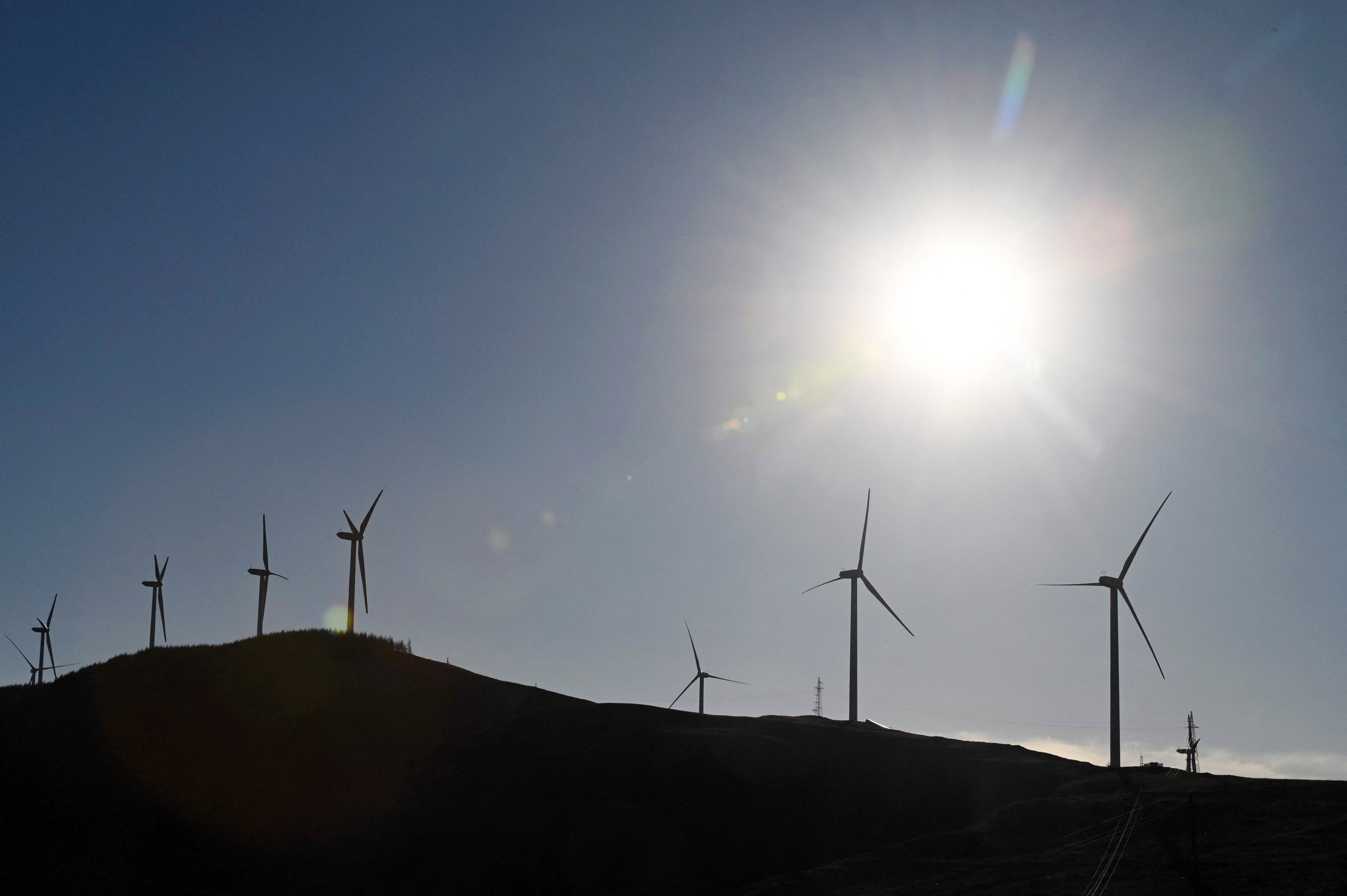 Wind turbines at Caozhuangci village in Baoding in China’s northern Hebei province. - China is the world’s biggest producer of wind turbines and solar panels. Photo: AFP