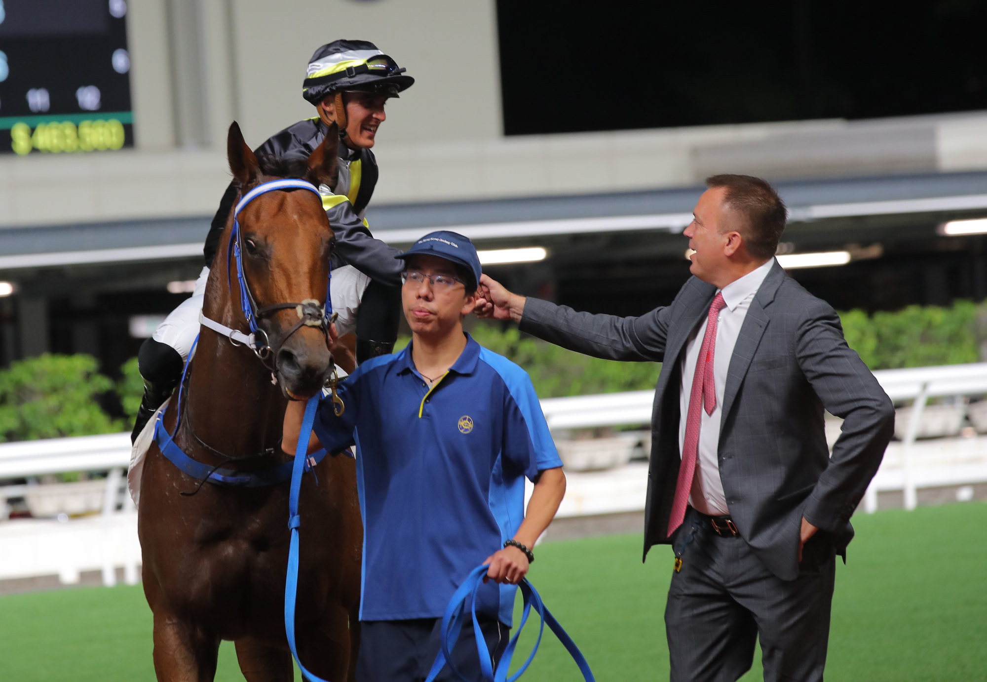 Trainer Caspar Fownes celebrates with jockey Keagan de Melo after Valhalla’s win at Happy Valley on Wednesday night.