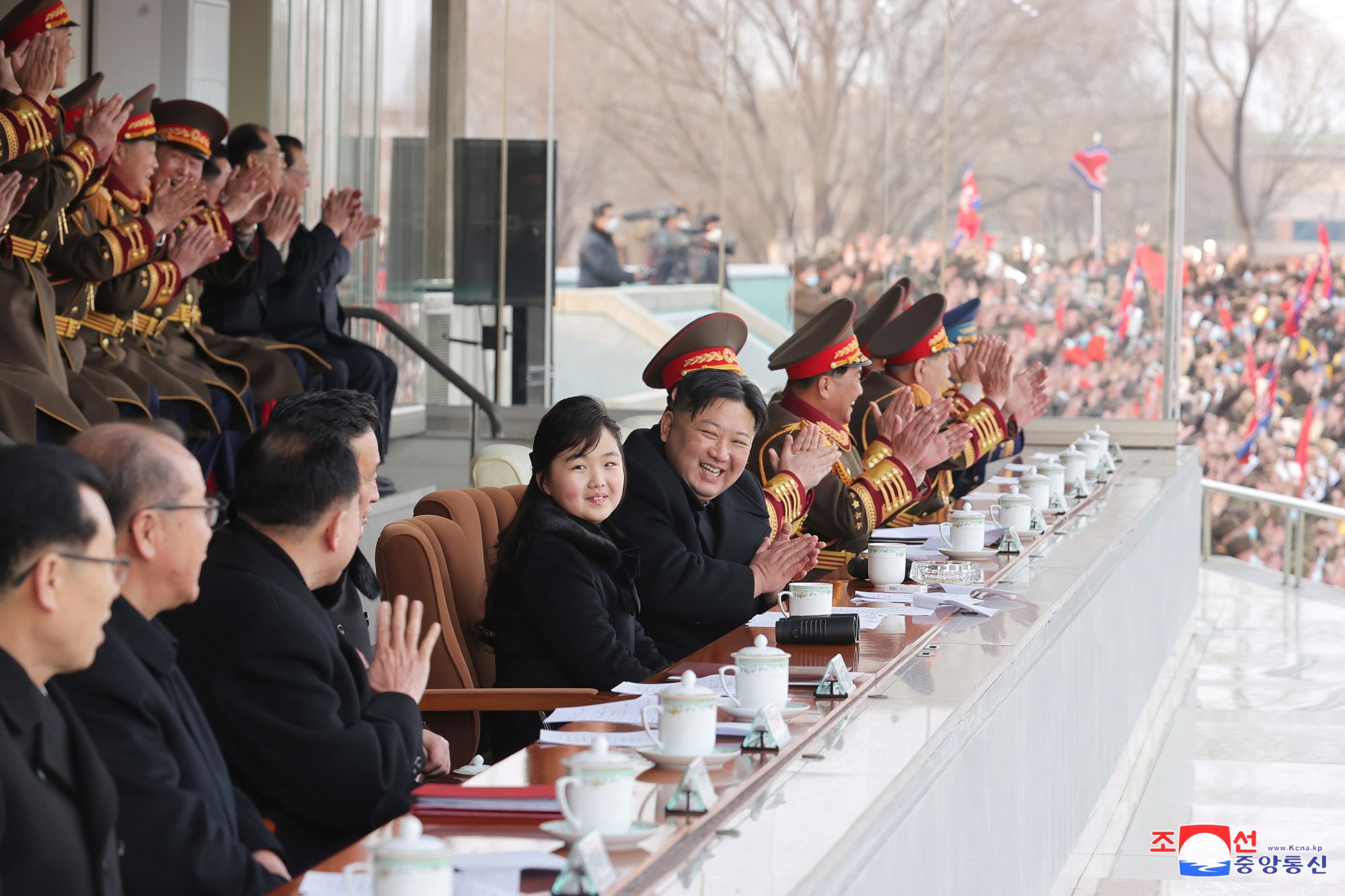 North Korean leader Kim Jong-un and his daughter watch games between government staff. Photo: EPA-EFE/KCNA