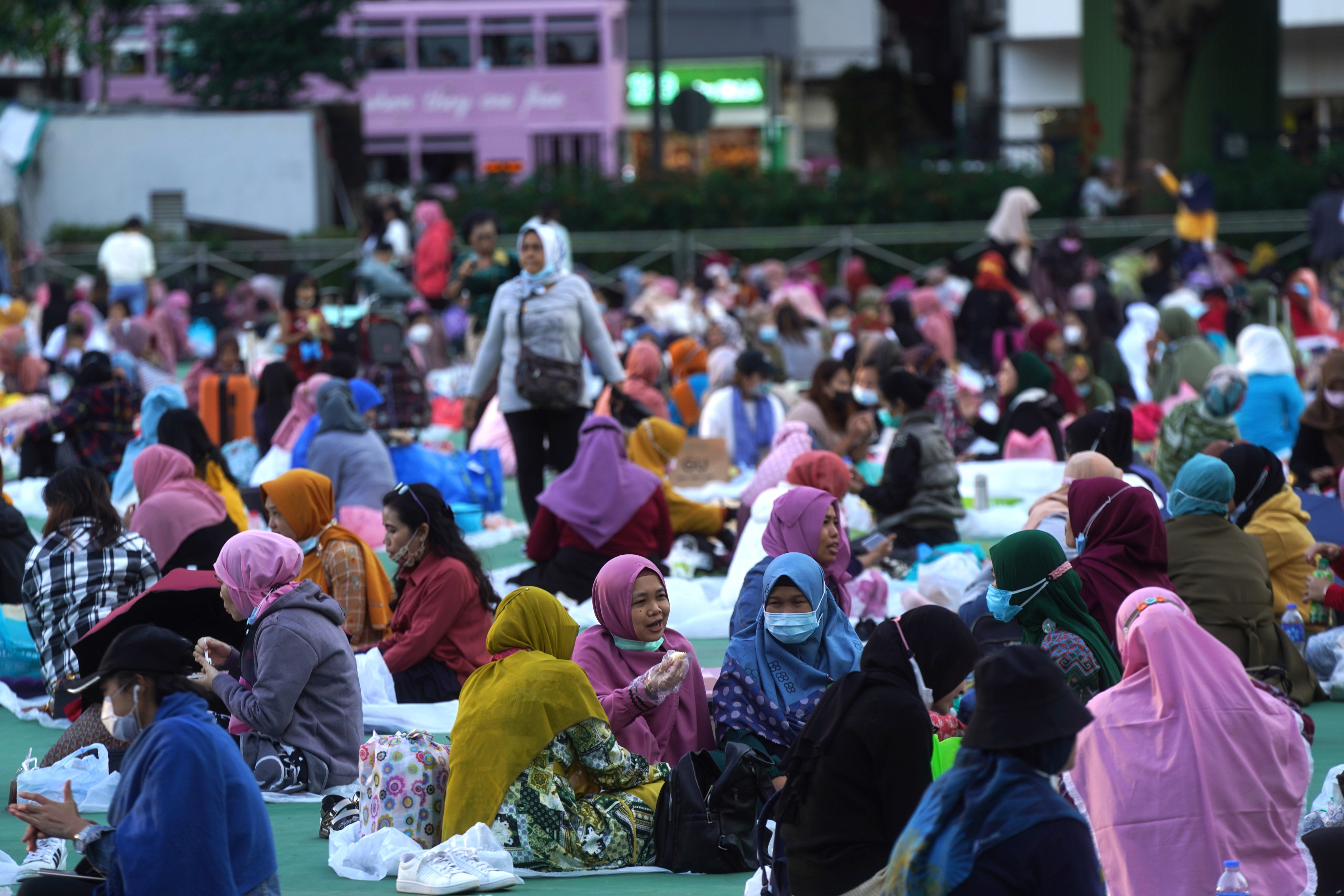 Domestic helpers spend their day off at Victoria Park in Hong Kong. Photo: Sam Tsang