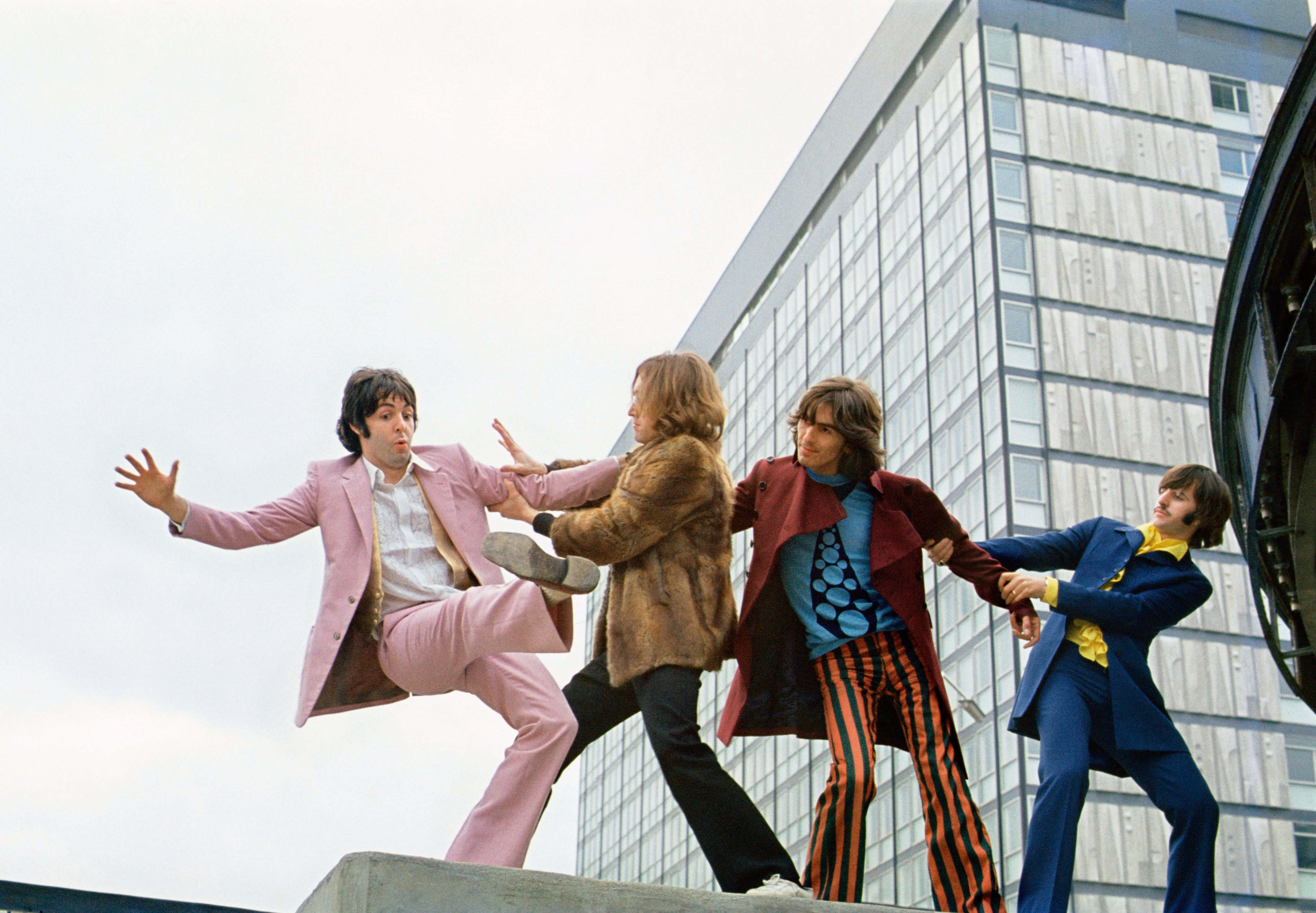 The Beatles in the summer of 1968 , in what became known as the “Mad Day Out” photo shoot. Garbed in bright, individualistic and contrasting styles, John Lennon, Paul McCartney, George Harrison and Ringo Starr are pictured at Old Street Station, London. Photos: Handout