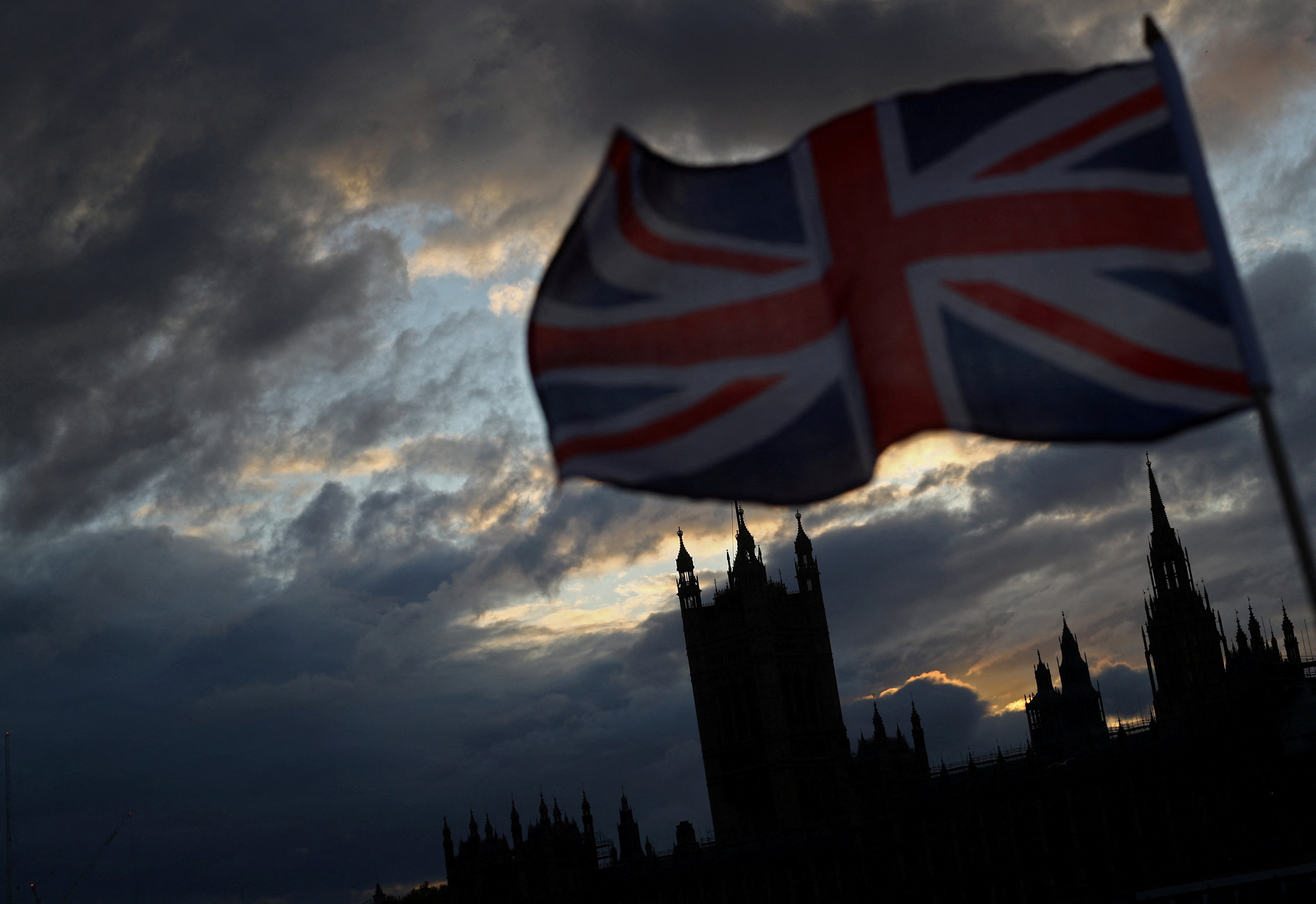 A Union flag flutters in front of the Houses of Parliament in London in November 2019. Photo: Reuters