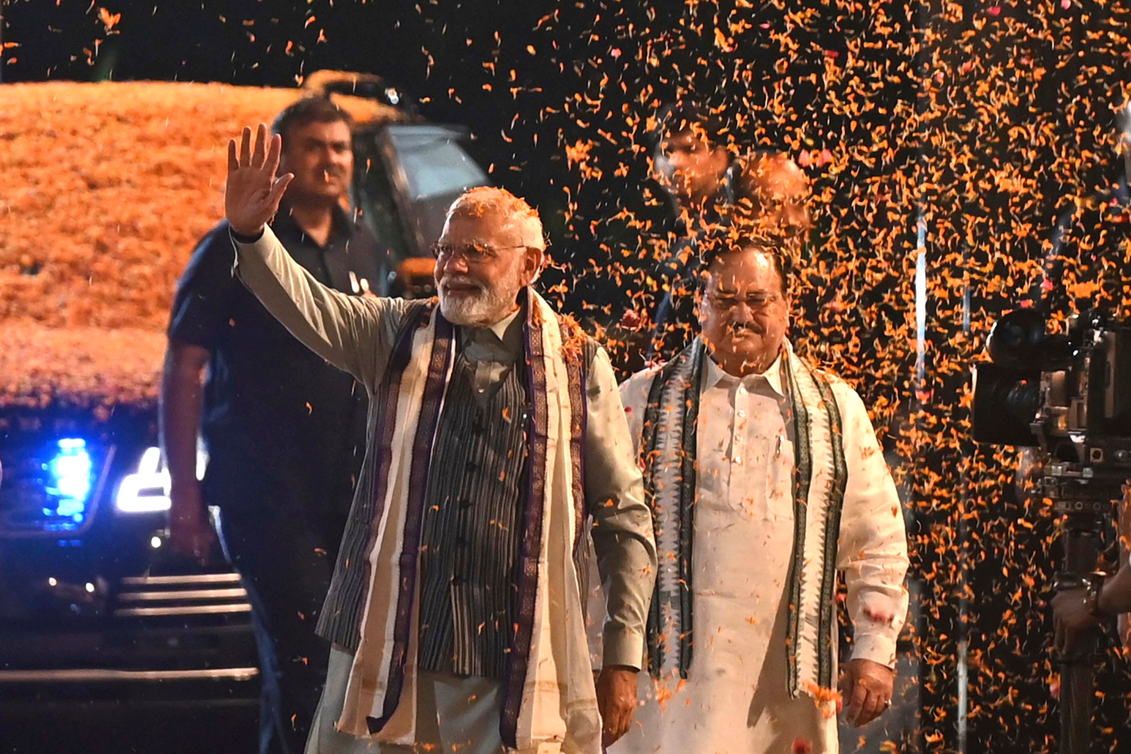 Supporters shower flower petals on Indian Prime Minister Narendra Modi on Wednesday after the country’s successful hosting of a G20 summit. Photo: AP