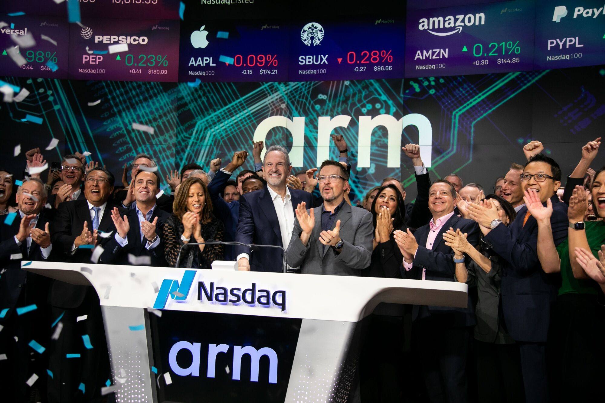 Rene Haas, CEO of Arm, centre, rings the opening bell with guests during the company’s IPO in New York on Thursday. Photo: Bloomberg